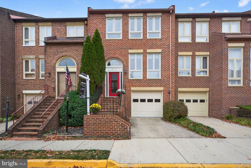 Rarely Available All-Brick Three Bedroom Townhouse with Garage in Prime Oakton Village!

All-brick garage townhouse located in the highly sought-after Oakton Village neighborhood. This home location is a true commuter’s dream, offering unmatched convenience near I-66, Route 123, and the Vienna Metro, plus quick access to popular local shops and restaurants.

Spanning three beautifully finished levels, this freshly painted home boasts three spacious bedrooms, two full baths, and two half baths.

The newly upgraded red front door leads you to the main entrance level welcoming you with an ample foyer and half bath, leading into a bright, spacious kitchen featuring abundant natural light from floor to ceiling windows, granite countertops, and stainless steel appliances. The open flow is perfect for entertaining, connecting the expansive dining room to the comfortable living room, anchored by a cozy fireplace.

The upper level is designed as a private retreat, highlighted by a large primary bedroom suite with a tastefully renovated ensuite bathroom. Two generously sized additional bedrooms and a second renovated full bath complete this level, ensuring comfort and style for everyone.

The lower level is built for relaxation and convenience, hosting a wonderful rec room with an additional fireplace. This level also includes the laundry room and features a walk-out to a fenced, private back composite deck — an idyllic outdoor escape. The convenience is sealed by the single-car garage, offering protected entry directly into the lower level.

Beyond the doorstep, you can immediately enjoy the vibrant Oakton Village lifestyle. Residents are granted access to fantastic amenities, including a community center, outdoor pool, exercise room, and playground.

Come and experience all that this wonderful neighborhood and move-in-ready home have to offer!

HVAC 2021, Roof 2016, Newer Windows, Replaced Attic Insulation, Trex Decking. 
Garage Refrigerator Conveys