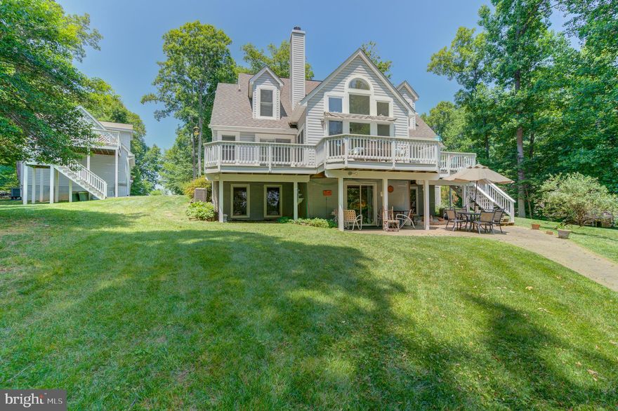 Discover your new lifestyle at this beautiful waterfront retreat located along the peaceful shores of Lake Anna's private side.  This lake home comes mostly furnished and has plenty of room for everyone in the family to spread out and relax comfortably.  4 BDRMS, 3.5 BTHS and a detached garage with a finished apartment above (3 bedroom septic).  This custom built cape cod features a wall of windows to enjoy the water views, vaulted ceilings, a wood burning fireplace, plantation blinds and hardwood flooring throughout the main level.  Main level primary bedroom suite has its own private access to the massive deck overlooking the lake, a walk-in closet and en suite primary bathroom with a tile shower and double vanity.  Upstairs you'll find two bedrooms, a full bath and loft area.  The finished walkout basement has a 4th bedroom, full bath and a family room/rec room. and laundry.  The finished suite above the 2-car garage has a full bath, kitchen and bed.  Take a stroll down to the water's edge that has 200 feet of shoreline, a large custom built boathouse with composite decking, metal roof, large screened room, boat slip with electric lift, storage room and sun deck! This retreat invites your imagination for new outdoor living ideas and peaceful enjoyment with a fire pit, sandy beach and pergola to relax and entertain your family and friends.  Great lake location and less than 15 minutes to groceries, local dining and so much more!  What more could you ask for?  Come envision your new beginning while it's still available!