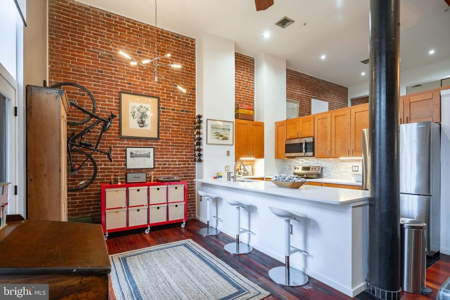 Welcome to 12 Letitia St #101, where urban living meets historic charm in the heart of Old City! This beautiful condo is move-in ready and offers a delightful blend of classic character and modern convenience.

As you step inside, you'll be greeted by gleaming 14' ceilings, Original beams, & hardwood floors that extend throughout the unit. The foyer entrance features elegant marble tile, setting the tone for the sophistication that awaits you. Fresh and cheerful neutral paint colors create an inviting atmosphere, making this condo feel like home from the moment you enter.

One of the standout features of this unit is the preservation of its historic charm, with exposed brick walls and original beams that add a touch of history to the space. These charming details harmonize seamlessly with the numerous modern updates that have been thoughtfully incorporated.

The kitchen boasts glass tile backsplash, granite countertops, stainless steel appliances, and a pantry with ample storage space. It's a culinary haven that opens up to the bright and spacious living room, where large windows flood the area with sunny, natural light.

The generously sized bedroom offers plenty of closet space and a slightly lofted design, ensuring both comfort and privacy. The bathroom is a relaxing retreat, featuring a soaking bathtub and a washer/dryer for added convenience. The grey tiles with black trim create a sleek and contemporary aesthetic.

But the appeal doesn't end there. This unit also provides access to a shared yard space, perfect for enjoying some outdoor relaxation. The common areas of the building have recently undergone a transformation, creating an elegant entrance that sets the tone for a luxurious living experience.

As an added bonus, a common roof deck, offering stunning views and a great place to unwind.

Location-wise, this condo is the epitome of city living, with a Walk Score® of 99. You'll be just steps away from the El, popular restaurants including the world-renowned Zahav, and the summertime hotspot Spruce Street Harbor Park.

For your convenience, the sale includes a private and caged storage unit in the basement of the building. The new AC, electric shades, all new Pella windows were installed, and a new door ensures your comfort and energy efficiency.

Don't miss the opportunity to make this stunning Old City condo your new home. Schedule a showing today and be prepared to fall in love with the perfect blend of history and modern living. Additional photos coming soon.