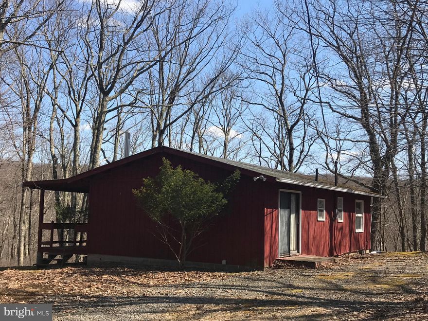 Need a weekend getaway?  Would a small home suit your needs? This home needs some TLC & is being sold AS IS.  This reasonably priced single on 1.8 acres offers an afordable price to " Live like you are on vacation"  in the private Community of Cove Village.  Reasonable membership fees & amenities add appeal. Some of the Cove Village amenities include a pool, lodge,basketball courts, playground, mini golf course & small lake for fishing.