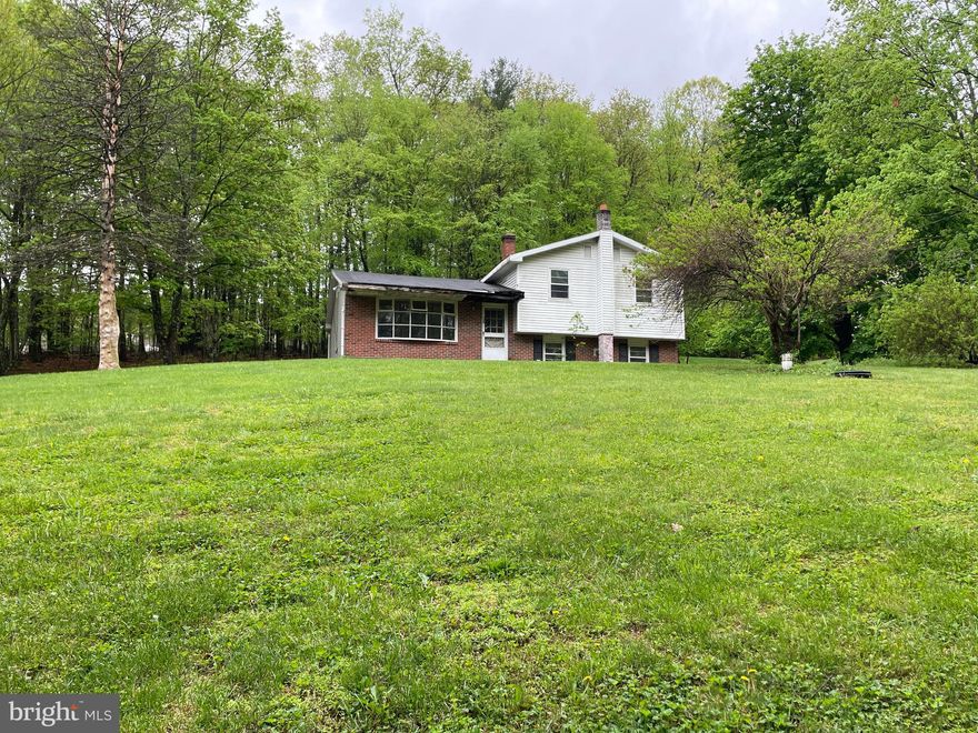 Picturesque location outside of Orwigsburg!  Bring your ideas, sweat equity and make this place your own!!  This home NEEDS some TLC so CASH or REHAB loan ONLY but all systems are up & running!  

The home sits on a gorgeous 1.07 acre lot overlooking peaceful rural views.  The main level has a kitchen, dining room and a HUGE Living Room with original hardwood floors. The upper level has 3 bedrooms with hardwood floors & Full bathroom.  Lower level has a spacious Family room, Laundry room & another full bath (needs a sink). There is also a Basement for all your storage needs!

This home has incredible potential and is SOLD AS IS!  INVESTORS & DIY'ERS now is your chance to pick up this beauty!!