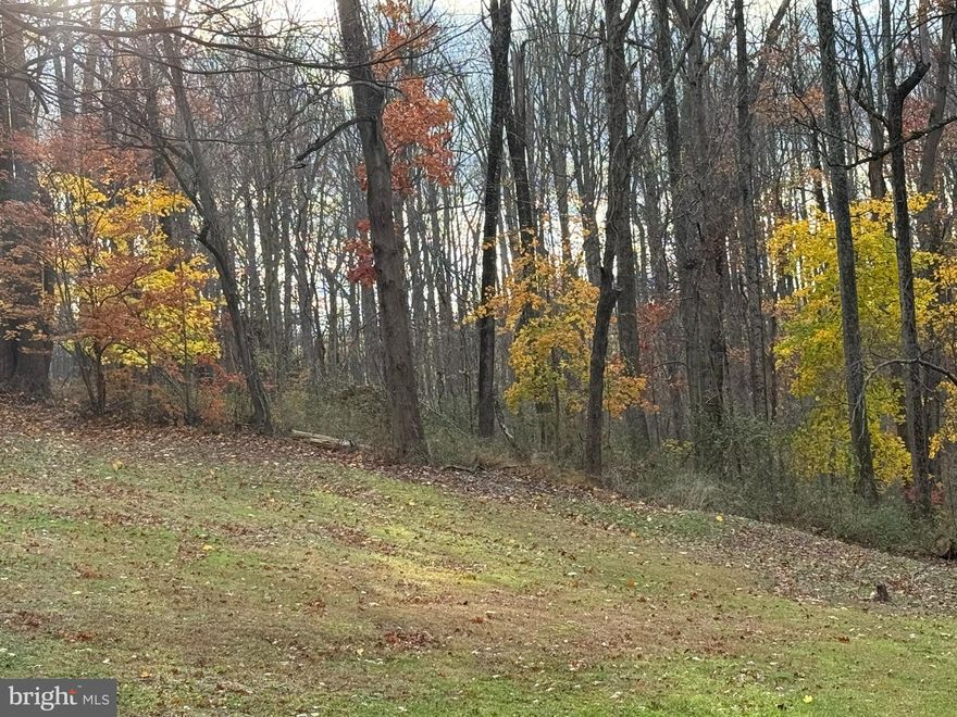 7 + acres of privacy and yet just five minutes to shopping, restaurants and major roads! Property includes a two-story farmhouse sold strictly AS-IS. Buyer to perform own due diligence, verify acreage, sq footage, zoning etc.