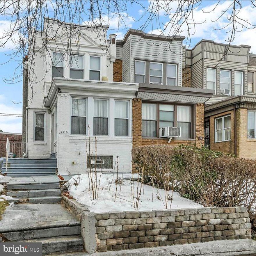 Welcome to this well maintained brick rowhome located in the desirable Wynnefield section of Philadelphia. Offering comfort, functionality, and flexible living space, this move-in ready home features thoughtful updates throughout.

The main level showcases hardwood flooring, recessed lighting, and a bright open living and dining area ideal for both everyday living and entertaining. The updated kitchen includes stainless steel appliances, ample cabinetry, and generous counter space.

Upstairs, you’ll find well proportioned bedrooms filled with natural light and a recently updated full bathroom featuring modern finishes.

The partially finished lower level expands the home’s versatility and includes a second full bathroom with a stand-up shower. Multiple defined areas provide excellent potential for a home office, recreation space, fitness area, or additional living area. A separate laundry area and additional storage complete the lower level.

Enjoy outdoor living with a raised rear deck overlooking the yard, perfect for relaxing or entertaining. Conveniently located near City Avenue, St. Joseph’s University, shopping, public transportation, and major commuter routes, this home presents a fantastic opportunity in the heart of Wynnefield.