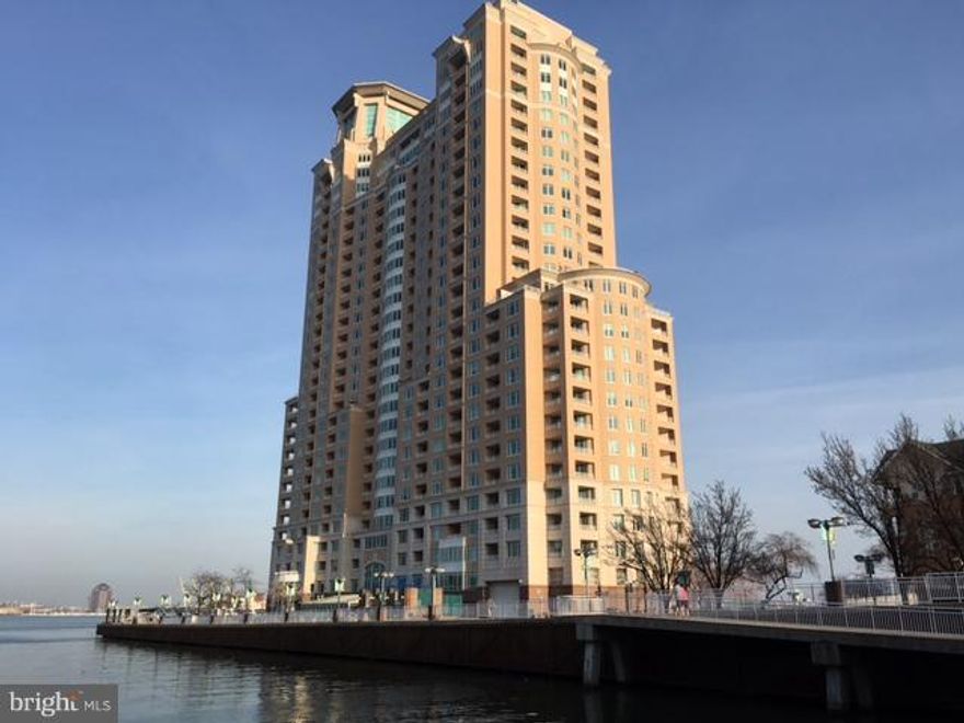 Premier renovated waterfront condo overlooking marina and Baltimore Harbor. Enjoy resort living in this lovely  Capri  model. Neutral decor, bedroom wall of glass, spectacular views, balcony, secure garage pkg. Building Ammenties: 2 swimming pools, fitness center, 24 hr. security, front desk staffing, on-site restaurant, mtg/community rooms. Close to Inner Harbor, shopping, downtown, restaurants.