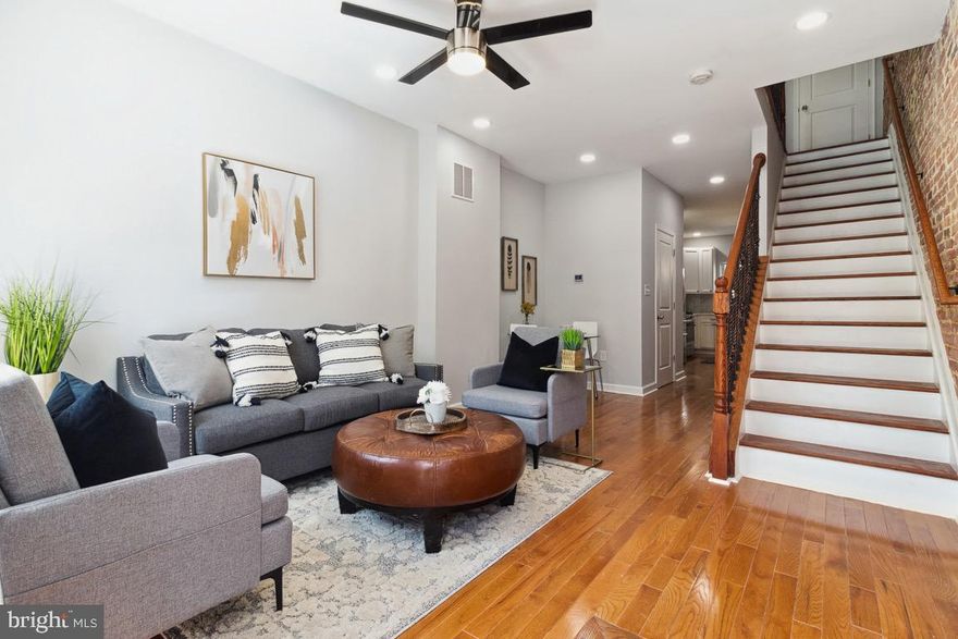 This fully renovated row home in central Baltimore offers the perfect blend of historic charm and modern convenience. With hardwood floors throughout, exposed brick, and an open floorplan, this home is both inviting and functional. The first floor features a powder room and brand new stainless steel appliances, countertops, and cabinetry in the kitchen. Step out to the backyard for outdoor entertaining and summer fun. The finished lower level offers additional space for entertaining, complete with a full bath and a room that can be used as an office or bedroom. Upstairs, there are two full bedrooms, including a primary bedroom with an en suite bath. Finally, the rooftop deck offers stunning views of Baltimore, and room for entertaining. This property may be eligible for LNYW, Vacant to Value, and other grant programs to help make city living even more affordable. Buyers should verify eligibility. The seller is motivated, bring all reasonable offers and a warranty is offered if the buyer closes with the seller's choice of title company.