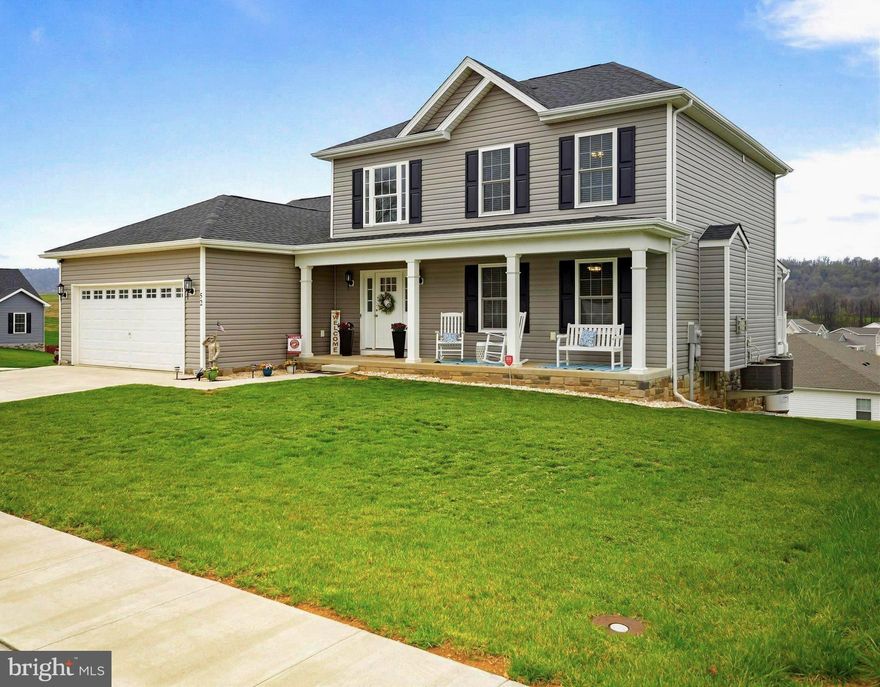 This stunning three and a half year old Colonial-style residence offers a perfect blend of modern elegance and comfort, making it an ideal sanctuary for those seeking a spacious and inviting living environment. Built on a large corner lot, this property provides ample outdoor space for either quietly relaxing with your morning cup of coffee or hosting that big family barbeque. Step inside to discover an interior that exudes warmth and sophistication. With the spacious master suite situated on the main level and three more bedrooms up on the second floor, this home is designed for functionality as well as casual living. An open floor plan seamlessly connects the combination kitchen and dining area to the living space, creating an inviting atmosphere for entertaining or just enjoying those casual family gatherings by the cozy gas fireplace. The kitchen features granite countertops, stainless steel appliances (including a refrigerator with dual icemakers and the super quiet dishwasher), upgraded soft close cabinetry, a pantry and the convenient island that doubles as a breakfast bar. The master bedroom space easily accomodates a king size bedroom suite and in the master bath you will enjoy the luxury of a double bowl vanity, a large walk-in ceramic shower with glass doors and the convenient access to the master walk-in closet. The finished lower level (complete with an oversized HVAC system in place) offers a tremendous family room suitable for everything from hosting a blow out Superbowl party to  providing the kids with their own space to just hang out with friends.  With the third full bathroom and a very large walk-in closet, you would have the option of utilizing the lower level as a spacious second master bedroom suite location (an optional fifth bedroom). Then with additional plumbing already in place for a future kitchen and another laundry set up, this level could be easily converted into a mother-in-law quarters with it's own private entrance and covenient walk out to a covered patio.  This home is not just about the interior; the exterior features are equally impressive. You will love the beautiful covered front porch, the convenience of an attached two-car front entry garage and the extra width of the concrete driveway, providing easy access and ample parking for guests. The neighborhood's charm and accessibility are enhanced by curbed and guttered streets and sidewalks throughout, allowing for that morning jog or a leisurely evening stroll. One of the standout features of this property is the breathtaking panoramic mountain views you will enjoy from the private covered  back porch. Imagine sipping your morning coffee while taking in the serene landscape or hosting evening gatherings under the stars. With its outstanding condition and modern amenities, this beautifully maintained home is ready for you to just move right into and make your own. Don’t miss the opportunity to own this exceptional property that combines luxury, comfort, and stunning views. Schedule your private tour today and experience firsthand the lifestyle that awaits you in this remarkable home!