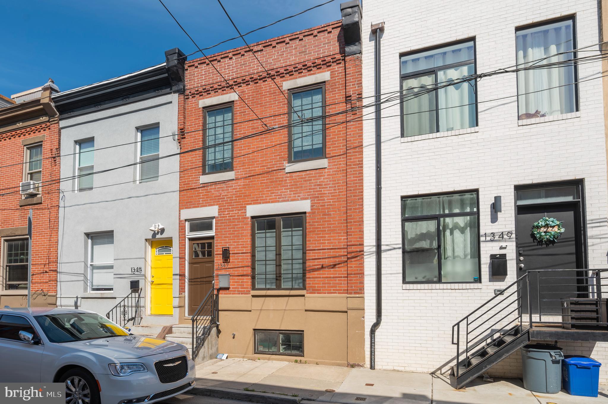 Stunning 2 BR, 2 Bath home in Grays Ferry!! The 1st floor features and open floor plan with hardwood floors throughout, partial exposed brick walls, custom wood shelves , newer kitchen with granite counter tops, SS appliances and tiled back splash. The door leading to an enclosed rear yard is conveniently located off of the dining room area. You can relax and barbecue in the comfort of your own yard. 2nd floor features 2 bedrooms and 2 full bathrooms. The large master bedroom has a tiled en-suite bathroom with stall shower, hardwood floors and ample closet space. This home also is equipped with central air conditioning, finished basement and much more. 5 years remaining on Tax Abatement!!! Agent is related to the owners!