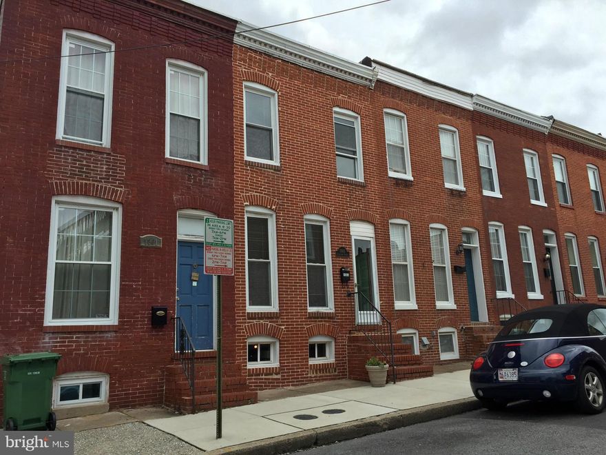 Move-in ready brick Fed Hill home w PARKING PAD for $225k!!! New wd floors in Liv & Din. New carpet on 2nd fl. New granite and st stl appliances in terrific open kit. Great space w/potential for 3 br's (1 is walk thru to the bath). 1st fl half ba & laundry. Central air. Recessed lights. Sec system. Easy walk to stadiums and everything Fed Hill. Super quiet non-thru street. New front door on order.