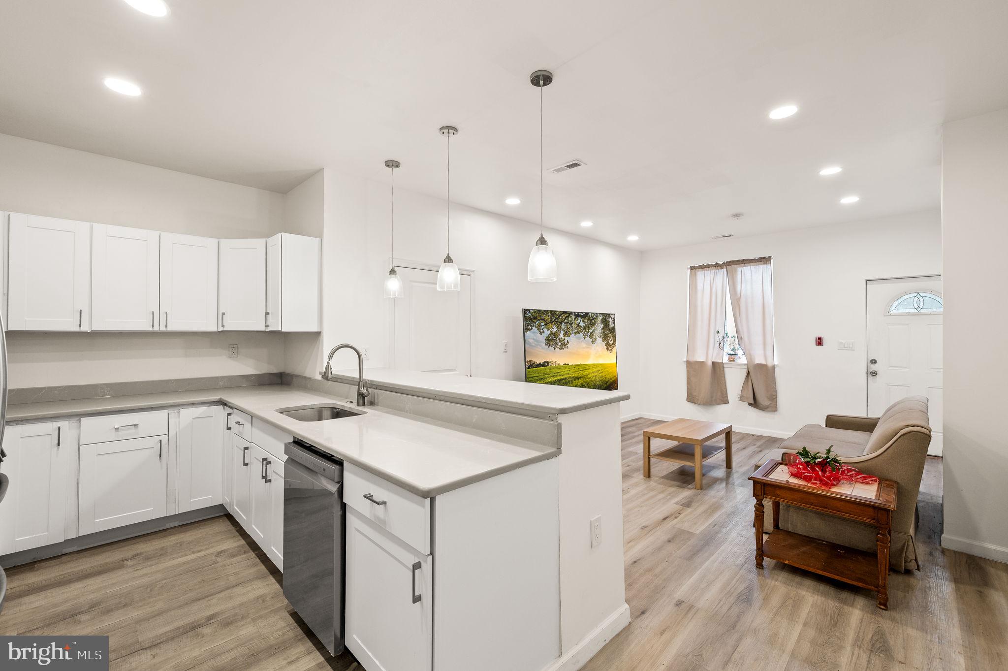 Now leasing! Welcome to your beautifully renovated FIRST FLOOR 2-bedroom, 1-bathroom home at 1633 Germantown Avenue in the vibrant Olde Kensington neighborhood. This spacious, light-filled unit features a modern open-concept layout, brand new flooring, sleek quartz countertops, and stainless steel appliances, making it the perfect place to relax or entertain. Both bedrooms are generously sized with ample closet space, and the remodeled bathroom boasts a luxurious walk-in shower. The first floor unit also has an adorable outdoor space for those tranquil summer evenings. Step outside and explore everything Olde Kensington has to offer, from the bustling shops and cafes like ReAnimator Coffee and Laser Wolf to local parks such as Liberty Lands Park and Girard Avenue Park. You’ll love the convenience of easy access to public transportation, bike lanes, and major highways, putting all of Philadelphia at your fingertips. Don’t miss the opportunity to make this beautifully updated unit your new home—schedule your tour today! Only barstools will be included - all other furniture will be removed prior to move-in.