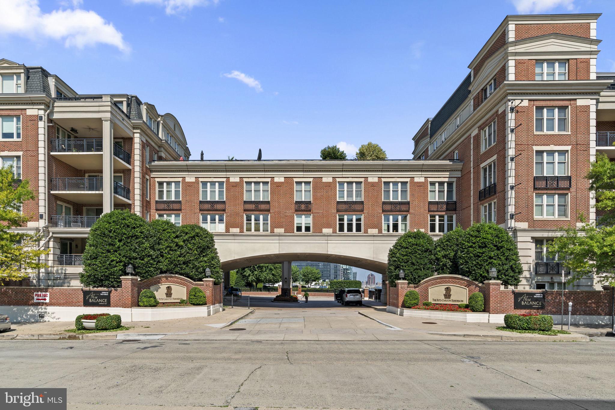 Sophisticated and spacious 2 bedroom 2.5 bath condo with two deeded parking spaces located at the Ritz Carlton Residences in Baltimore's Inner Harbor. The open concept living room / dining room floor plan is stunning and the bedrooms are located at each end of the condo for maximum privacy. Gourmet kitchen has beautiful wooden cabinetry, Viking S.S. appliances and granite countertops. Ample sized laundry room is conveniently next to kitchen. Living room has gas fireplace and access to balcony overlooking Baltimore's Visionary Art Museum. Balcony is also accessible from 2nd bedroom with bath. Primary bedroom has a large walk-in closet and spacious bathroom with soaking tub, walk-in shower and separate vanities. Gorgeous hardwood flooring throughout living room, dining room, bedrooms and hallways. Great location to Inner Harbor areas, Promenade, water taxi, Federal Hill Park, restaurants, shopping, museums and entertainment. Must see to experience luxurious condo living in the heart of the city.