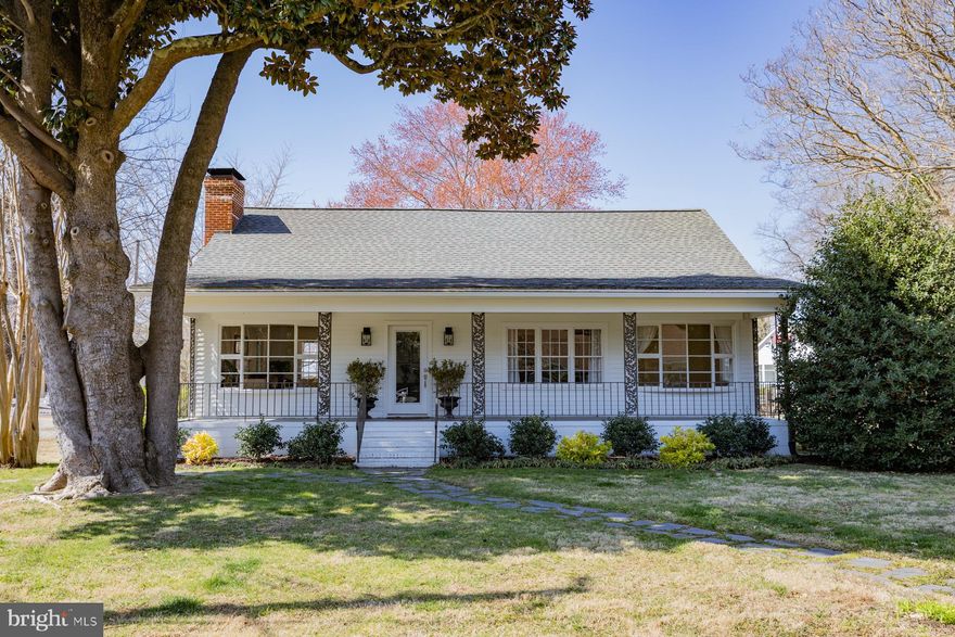 The quintessential cottage with views of Carter’s Creek, a new covered back deck overlooking a large fenced yard and a full length front porch bordered by lovely landscaping.  This 2 bedroom home in the heart of Irvington boasts a spacious living room with gas fireplace and creek views, a remodeled kitchen with center island, a separate dining room and family room (currently used as the primary bedroom) and two remodeled full baths. Hardwood floors, kitchen backsplash and faux tin ceiling, tiled showers and custom vanities are some of the details that give this home unmatched character.  Located within walking distance of everything  Irvington has to offer, this is an ideal place to watch sunsets over the creek and to call home.