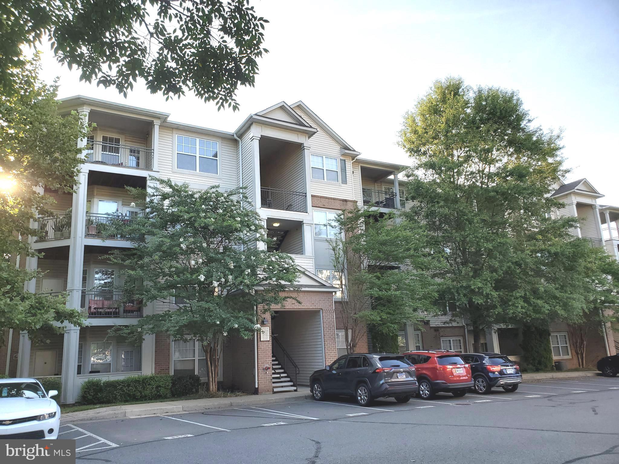 Wonderful 1 bedroom & 1-full bath condo in the fantastic gated community of Legato Corner. Beautiful wood floors through out. New ceiling fans and blinds. New recessed lights in kitchen area. Great open floor plan with 832 sq ft of spaces. Great corner unit with loads of windows and natural lights. Living room with cozy gas fireplace. Dining room steps out to huge wrap around covered balcony with private wooded views. Great kitchen with stainless steel appliances and granite counter tops. Separate laundry room with full size washer/dryer and plenty of extra storage. Spacious bedroom with deep walk-in closet. Full bath with dual vanity, over sized soaking tub with shower and linen closet. Built-in office with desk and bookshelves. Large storage (5' L x 5.5 W x 9' H) adjacent to the unit door. 1 reserved parking spot and many visitor spots. Private gated community with great amenities including clubhouse, pool and fitness center. Short walk to bus stop. Just minutes to Fairfax Corner, Fair Oaks Mall, Government Center. Commuter friendly location is close to I-66, Rt. 29 and Rt. 50.