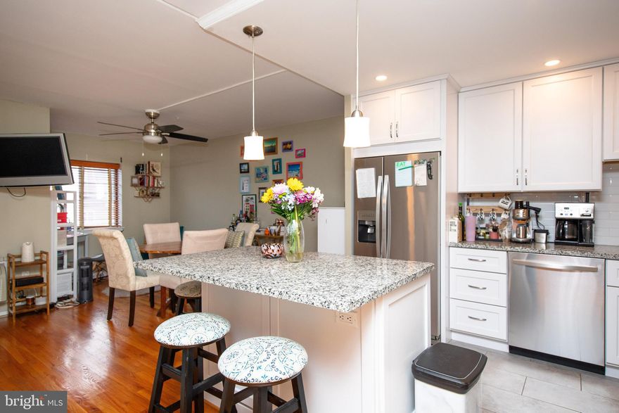 Enjoy convenient living in Society Hill. This 824 sq. ft. home features a spacious living room and dining area large enough to accommodate a 6-seat table with ease, a large, carpeted bedroom, powder room for guests, and your own, attractive full bath. Brand new kitchen with stainless steel appliances, built-in microwave, tile backsplash, new recessed lighting with a dimmer with LED bulbs, and an island for extra storage and an overhang for informal dining. These renovations maximize light, space and air. You will love this customized unit that includes 2 mounted Flat Screen TV's with wall-mounted speakers, custom contemporary, high quality wooden window blinds, shining, solid oak, hardwood floors, and soft carpeting for bare feet in the bedroom. 3 Spacious Closets include: 1 California-style walk-in and 1 with a built-in desk, plus mirrored folding door hallway closet. Have your morning coffee on the peaceful Balcony and enjoy the Spectacular City Skyline Views facing North (the more desirable quiet side) of the building. Stove, Washer & Dryer were replaced a few years ago. The building features on-site Management and is Cable ready.  The Gym is included in your condo fee as well as hot water. You'll love the security and convenience of having 24 hours Front Desk Concierge & Maintenance service plus an on-site fitness center. Live the walking life with the Ritz movie theaters, a myriad of restaurants and coffee shops, historic sites, the waterfront, museums, grocery stores, the spectacular Sunday farmer's market at Head House, festivals, great public transportation, and practically everything else you need! Note there is an addition tax paid to the South Street Headhouse Association for $420.92 per year.