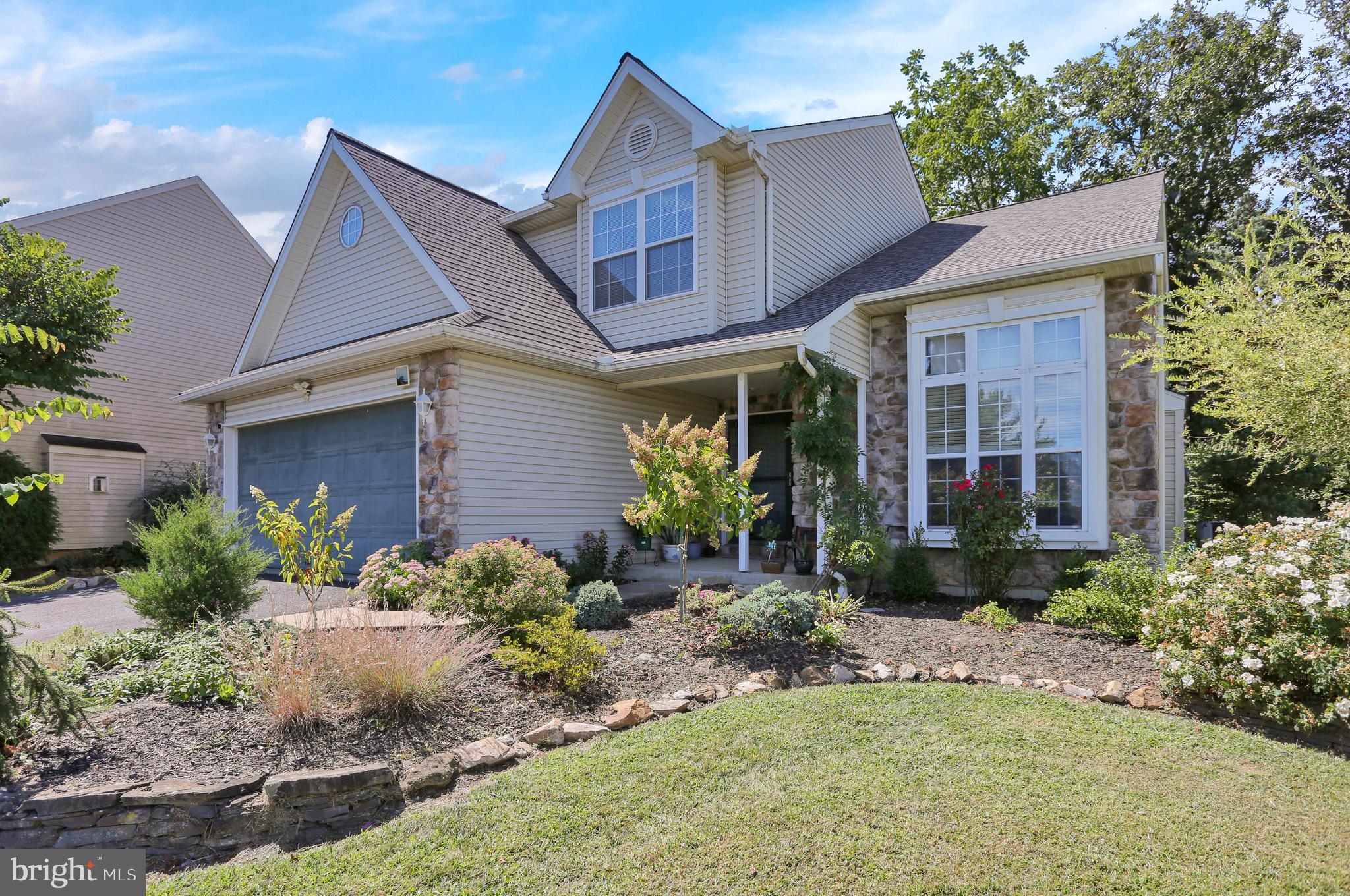 Located in the highly sought after Werner Farm Community in Wilson Schools!  Great curb appeal w/ a traditional yet slightly contemporary look to it.  One of the larger lots in community at over 1/3 acre.  Two story living room with lots of natural light.  Spacious formal dining room with hardwood floors.   Finished basement separated into two areas - Play area and really nice bar area w/ powder room (invite your friends)! Intimate rear yard with landscape wall, mature plantings and large paver patio.  NEW ROOF August 2022!!