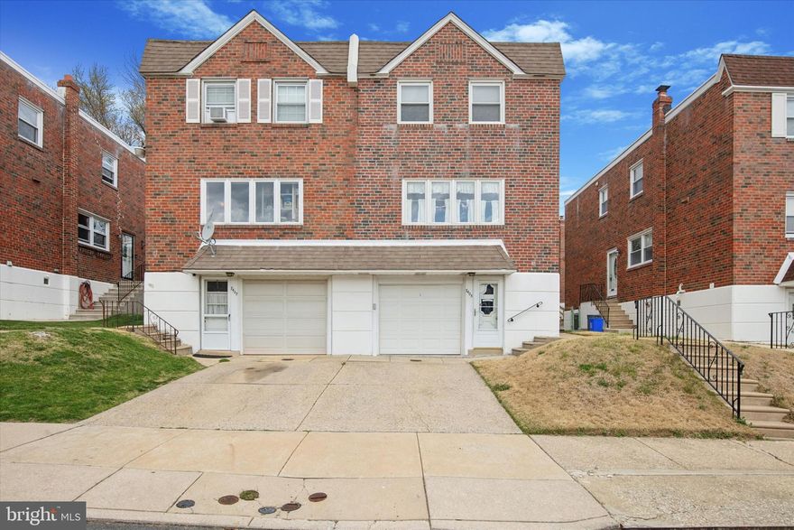 Welcome to 7405 Hill Rd, a classic brick semi-twin tucked into one of Roxboroughs most convenient and charming neighborhoods. This 3-bedroom, 2.5-bath home offers a warm, inviting feel from the moment you arrive, with a clean brick exterior, private driveway, and attached garage.

Step inside and experience the natural light streaming through oversized windows, bouncing off beautifully preserved hardwood floors. The main floor layout is designed for everyday ease, offering a cozy living space that flows into a functional kitchen complete with breakfast bar seating, gas cooktop, wall oven, built-in microwave, and clever storage solutions including a pantry closet. A convenient powder room is also tucked on this level for guests.

Upstairs, the spacious owner’s suite boasts dual closets and a private ensuite bath with walk-in shower. Two additional bedrooms offer ample closet space and share a well-kept ceramic tile hall bath.

Downstairs, the partially finished basement expands your living and storage possibilities — plus it opens directly to a lovely, fenced rear yard with patio space ideal for relaxing, gardening, or entertaining.

Enjoy off-street parking for two, including a garage and driveway. So much to do nearby...Wissahickon Valley & Fairmount Parks, Kids at Play amusement center, Fairmount Water Works for guided tours & exhibits & more, Wagner Free Institute of Science, plus lots of shops, restaurants, food stores and more. Easy access to Center City Philadelphia, Wilmington and King of Prussia.  Close to bus and regional rail lines. This is city living, balanced with nature and neighborhood warmth, don’t miss your chance to call it home.