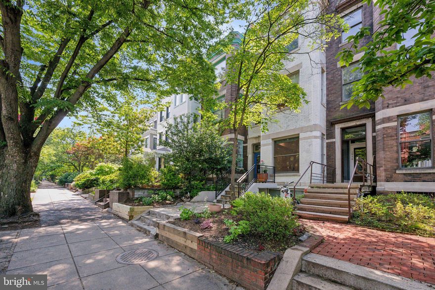 Positioned between the dramatic natural beauty of Rock Creek Park and bustling Adams Morgan, this 1 Bed/1.5 Bath home, with approximately 1,000 sq ft of living space strikes a perfect balance at every turn. Open and bright, the large main living area is an entertainer's dream, with dedicated living and dining spaces featuring warm hardwood flooring throughout. The gourmet kitchen, thoughtfully separated from the living area, is marked by an exposed brick wall that contrasts perfectly with tidy white cabinetry, marble countertops, and a stainless steel appliance suite. To the rear of the home, the primary suite boasts ample storage, ensuite bath with soaking tub-shower, laundry closet, and access to a deck with southern exposure, ideal for grilling, an herb garden, and bistro set. Off-street parking is conveniently located just below the deck. However, at less than a ten minute walk to Woodley Park Metro with Rock Creek, Walter Pierce, and Kalorama Parks, as well as the endless dining, shopping, and offerings of Lanier Heights and Adams Morgan just around the corner, you can leave the car at home more often