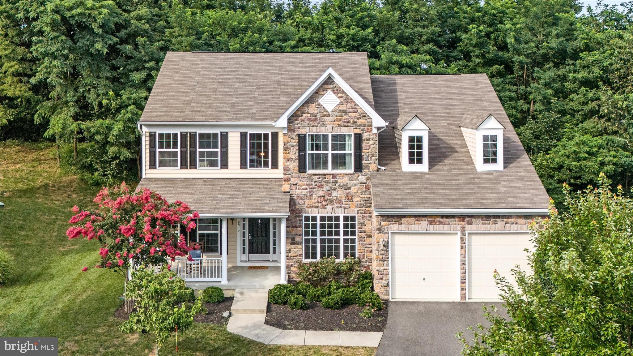 Perfectly situated on a quiet cul-de-sac, this beautiful stone-front home is surrounded by mature trees and backs to the serene Williams Gap Vineyard, an ideal setting for those who appreciate privacy and picturesque views.
From the moment you arrive, the home’s charming curb appeal shines with its inviting front porch, a gorgeous blooming crepe myrtle, freshly painted shutters, and a two-car garage. Inside, the thoughtful floor plan offers a main-level office, perfect for remote work, a convenient laundry and mudroom off the garage, and a welcoming dual staircase.
The main level has been enhanced with new light fixtures and flows seamlessly to the back deck and stone patio ideal for summer entertaining. Recent updates include a new microwave and double wall oven (2025), new washing machine (2024), elegant plantation shutters, custom framing around the downstairs windows, a water softener, and a security system for added peace of mind. The main level also features a butler’s pantry, perfect for entertaining and extra storage.
The walk-up basement is fully finished and features a full bathroom, plenty of storage, and a rough-in for a 5th bedroom, offering endless possibilities for expansion. Upstairs, the spacious primary suite boasts a large walk-in closet and a luxurious en-suite bath.
All of this is just minutes from Sleeter Lake, Great Country Farms, local wineries and breweries, and miles of scenic hiking trails. Don’t miss your chance to live in this vibrant neighborhood. Western Loudoun living at it's best!
Welcome to 16972 Buckington Court in the highly sought-after Mountain Valley community of Round Hill, VA!