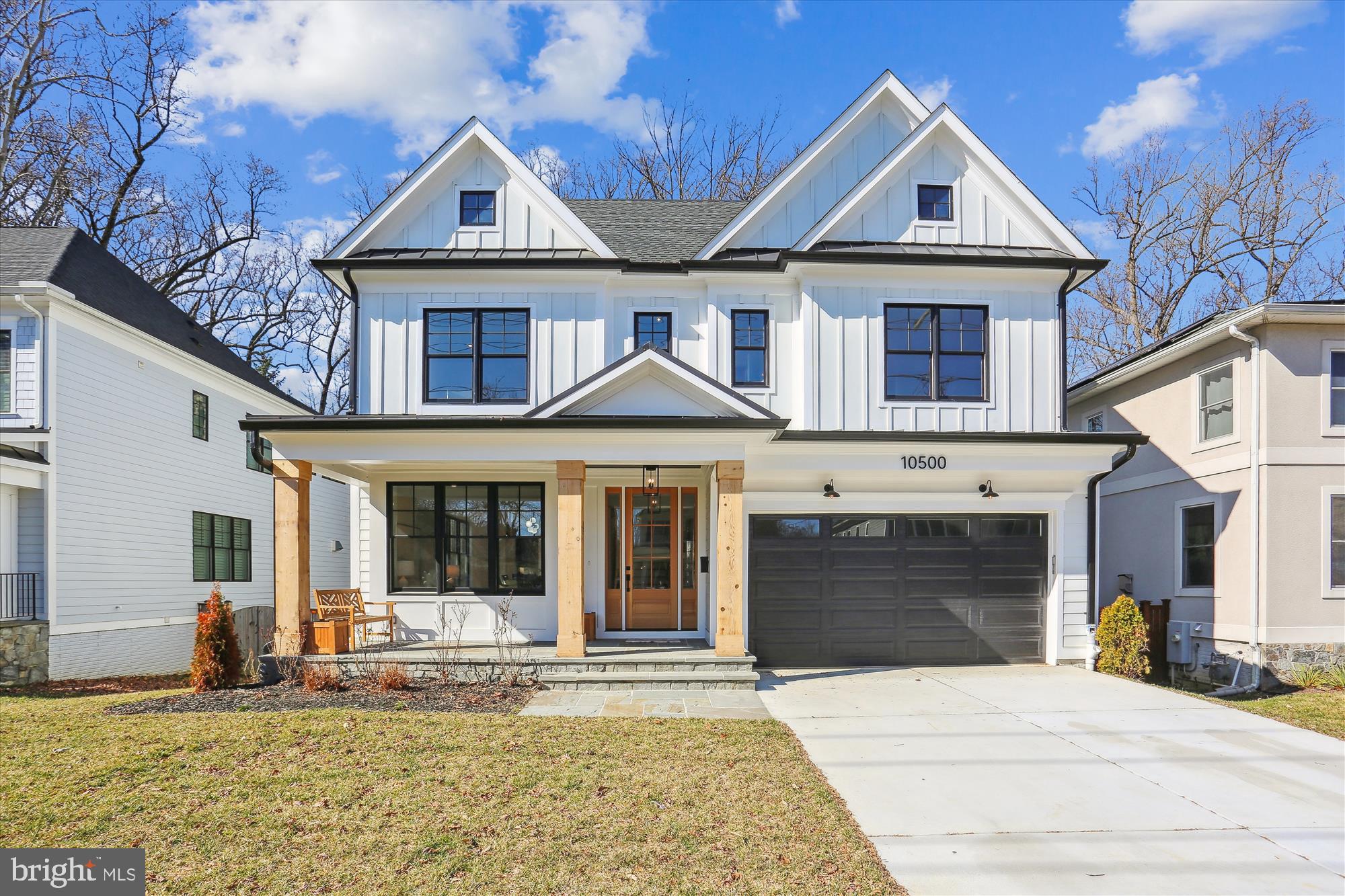 Welcome to 10500 Parkwood Drive, a spectacular newly constructed home crafted by the award-winning West Hill Builders. Meticulously designed with exceptional workmanship and the finest materials, this residence showcases unparalleled quality and attention to detail. Nestled on a beautiful lot backing to trees and park in the sought-after location of Kensington, this property offers both convenience and tranquility.
Approaching the home, you are greeted by a flagstone walkway leading to a central portico, boasting an inviting front porch adorned with 12" solid cedar columns, overlooking the meticulously manicured front lawn. Stepping through the solid wood and glass front door, you are immediately captivated by the grandeur of the floor plan, spanning over 5,300 square feet.
The interior of this home boasts stunning features such as fabulous stained oak flooring, extensive millwork, and 9 + foot ceilings on each level. The craftsmanship is evident as you enter the exquisite foyer, with its striking grand staircase, private office to the right, and formal living room across the way. The living room seamlessly flows into a banquet-sized formal dining room adorned with a designer chandelier, creating an ideal space for entertaining.
The butler's pantry connects the dining room to the kitchen, providing the option for open-concept entertaining or a more intimate atmosphere. The kitchen itself is a chef's dream, featuring stunning contrasting cabinets, marble countertops, and top-of-the-line appliances from Jenn Air, including a 48" range, 48” custom refrigerator, and high-velocity exhaust hood. Adjacent to the kitchen is the family room, complete with a natural gas fireplace, custom millwork and expansive windows offering views of the verdant backyard. Direct outdoor access to the deck and yard further enhances the seamless flow between indoor and outdoor living spaces. Completing the main level is a powder room and a spacious mudroom area with custom built in cubbies and access to the two-car garage.
Ascending the grand staircase, you reach the upper level's central vestibule, which leads to a wide landing area. The primary suite is a sanctuary of space and luxury, featuring two large walk-in closets and a lavish bath. The bath offers a multitude of amenities, including a freestanding soaking tub, a multi-jetted shower, and heated floors in the exquisite wet room. Three additional generously sized bedrooms on the upper level each boast high ceilings and uniquely styled ensuite baths. A cozy second-story family room provides a perfect space for relaxation and can also function as a seventh bedroom if desired. Completing the upper level is a convenient main laundry room.
The home also offers a fantastic third level, comprising a large bedroom, a full bath, wet bar and a phenomenal bonus room, adding versatility to the floor plan. The lower level presents a spacious recreation room and storage rooms that can be tailored to suit your needs. It is perfect for entertaining, featuring a dry bar, combination wine/beverage center, a mirror-walled fitness center, a spacious bedroom, and a full bath. Stepping outside, the rear deck provides a serene retreat overlooking the lush trees.
This remarkable home is built to last, with features such as Hardie siding, a 50-year roof, Andersen windows, standing seam metal roof, oversized gutters, and even a Tesla/EV rough-in. It also includes a whole-house sprinkler system for added peace of mind. Ideally located just off Beach Drive, where no cars are allowed to drive on Saturday and Sunday, minutes away from downtown Kensington and Bethesda, and within close proximity to the Beltway, major airports, and Washington DC, this residence falls within the coveted Walter Johnson school district and offers easy access to all amenities.
With its stunning aesthetics, impeccable craftsmanship, and unbeatable location, 10500 Parkwood Drive is the epitome of the perfect place to call home.