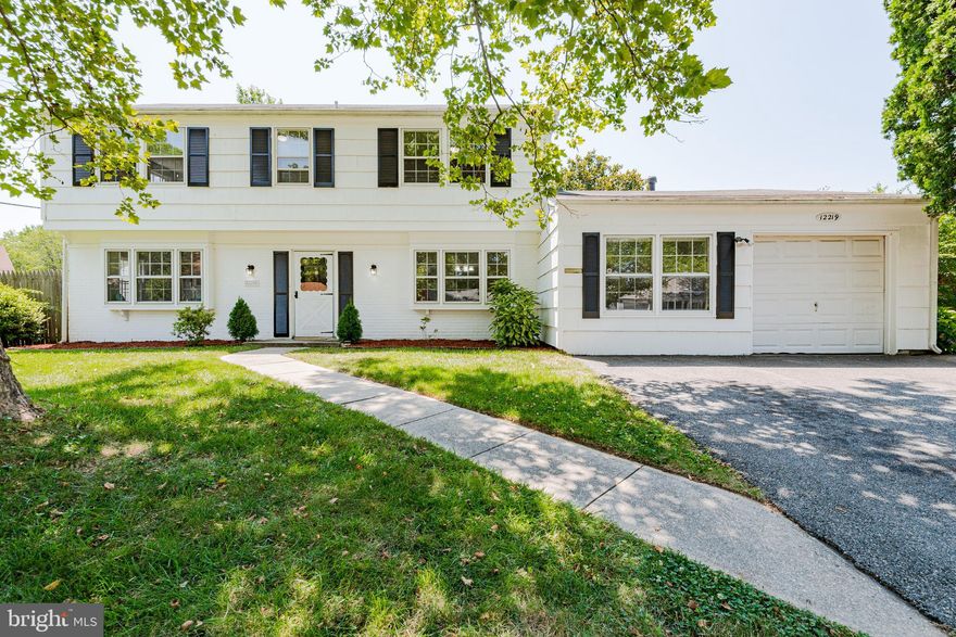 Large colonial in the heard of Bowie offers new flooring main level, new carpet bedrooms/upper level, and fresh paint. Large eat-in kitchen with white cabinets, new granite countertop, double sink overlooking the window, modern faucet, and exposed brick. Large living room. Formal dining area. Sunroom with patio access. Master bedroom with en-suite bathroom and his and her closets. 5th bedroom or Office on the main level. Additional storage room in the garage. Flat backyard fully fenced. Expanded driveway parks 4 cars. Laundry room behind the kitchen. Entertainment and shops nearby including Bowie Town Center, Bowie Marketplace, Bowie Golf Club, Bowie State University, Six Flags America, Route 50 and B/W Pkwy, Andrews AFB, Fort Meade and so much more. Move-in ready: Welcome Home!