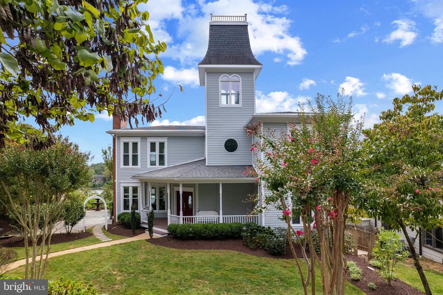 Perfectly sited waterfront home overlooking the beautiful South River!  Take in the panoramic views from almost every room in the house or relax and enjoy watching the wildlife and boating activity from the multiple decks and stone patios. The elevated southern exposure creates endless views and captures beautifully colored skies at sunset. With 3 finished levels, 5 bedrooms, 4.5 baths including the full bath and bonus room/bedroom in the detached garage, deep water private pier and plenty of outdoor living space; this property has something for everyone and ample room to accommodate them! The high ceilings and brand new windows throughout frame the water views and allow tons of natural light to pour in.  The Living room features a cozy wood-burning fireplace, open floor plan and access to the full length balcony that connects to the Kitchen/Dining area.  Newly refreshed in 2015 the chef's Kitchen is equipped with an abundance of cabinets, counter space, high-end appliances and the views will inspire! An oversized powder room and adjacent bonus room complete the main level.  The waterside Primary suite with luxurious bath is the best place to unwind after a long day, and sitting out on the adjoining private balcony overlooking the South River will melt away any stress. The secret passageway up to the striking turret will delight family and guests of all ages! The lower level walkout doesn't disappoint with additional living space, bedroom and bathroom and direct access to the expansive stone patio. Need even more space? The detached 2 car garage offers a full bath and spacious room perfect for a gym, home office, guest room or whatever you can dream up! The convenient tram makes getting to the water accessible to all and as easy as a push of a button.  The deep water pier with a 40,000 lb boat lift is sure to satisfy any boating enthusiast. Keep multiple boats ready to cruise down the South River out to the Chesapeake Bay and beyond. Welcome Home!