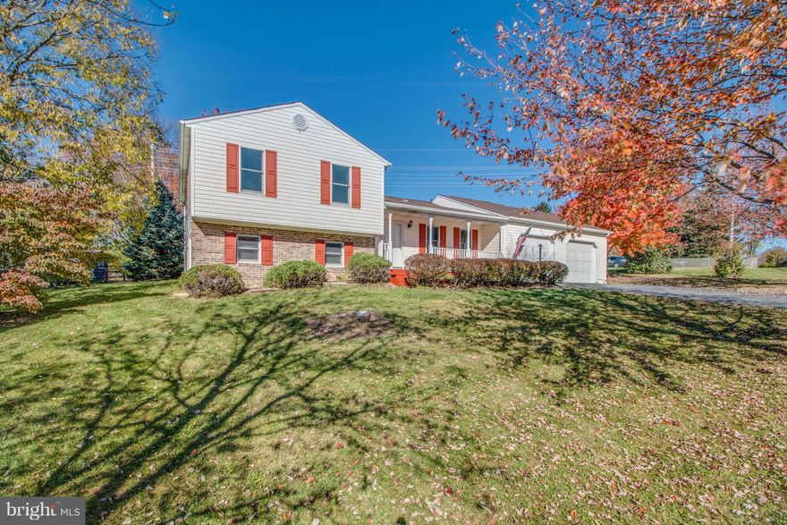 Beautifully Updated Split-Level on a Corner Lot! This 4 bed, 2.5 bath home features an open layout, hardwood floors, updated bathrooms, spacious lower-level family room with walkout and living room w/ enclosed porch. Parking is never an issue with 2-car attached garage including extra storage space and large driveway. Master features beautifully updated master bath and walk-in closets. A must see!