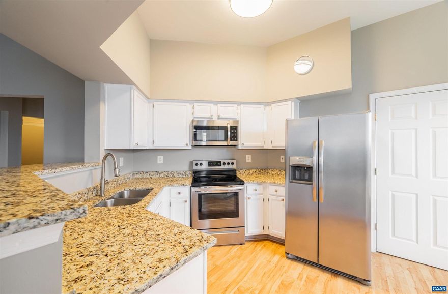 This BEAUTIFULLY UPDATED 2-BED 2-BATH, 1,377-FIN SQ FT CARRIAGE HILL CONDO features 11' CEILINGS, an open concept floorplan, and impressive improvements such as LUXURY VINYL PLANK FLOORING and new light fixtures, window treatments, ceiling fans, and hardware! Prepare meals in the WHITE EAT-IN KITCHEN, featuring GRANITE COUNTERTOPS, TWO SPACIOUS PANTRIES, and STAINLESS STEEL APPLIANCES, and dine either at the COUNTERTOP BAR, BREAKFAST NOOK, or DINING ROOM! Relax by the WOOD-BURNING LIVING ROOM FIREPLACE or take in the SEASONAL MOUNTAIN VIEWS from the COVERED BACK PATIO! Rest easy in the SPACIOUS PRIMARY SUITE, featuring a LARGE WALK-IN CLOSET and sitting area! Enjoy the NEIGHBORHOOD AMENITIES such as POOL, CLUBHOUSE, TENNIS, and more as well as being CONVENIENTLY LOCATED at Pantops just minutes from Sentara Martha Jefferson Hospital, UVA/UVA Hospital, Rivanna River trails, restaurants, shopping, and more! Open House Sunday 02/25 2-4PM!,Granite Counter,White Cabinets,Bus on City Route,Fireplace in Living Room
