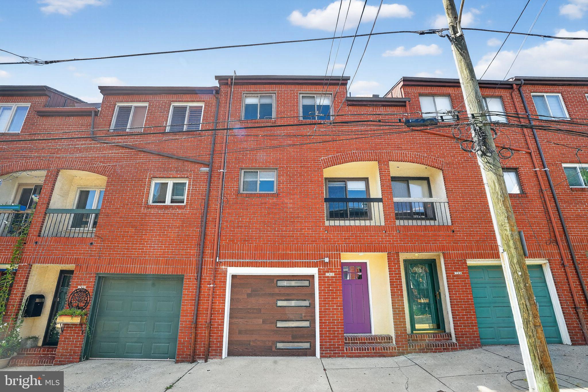 Complete Renovation of this split level Rowhouse, over 2000 sq ft, in the Fairmount neighborhood. Newly installed solar array projected to offset at least 92% of the household energy use! Enter in to a generous entry tiled Hall, with direct access to a full sized garage. Down a few steps there is a large coat closet, rear office/den/gym space with half bath, laundry area, mechanical area and polished concrete floors Half level up to a full width Living Room, with high ceilings, recessed lighting, red oak floors and sliding glass doors to bricked patio. Another half a level up to Kitchen/ Dining. Kitchen with custom white oak cabinets, pantry, stainless steel appliances- induction stove top and convection oven, island with built in microwave drawer and wine cooler, quartz countertops, tile backsplash and wood floors. Up to a rear Bedroom with large closets, Hall tiled Bath with shower and custom white oak vanity. The front main Bedroom with cathedral
ceiling, ensuite bath with double sinks, custom made white oak vanities and a wall of closets. Another rear bedroom with cathedral ceiling, wood floors and large closet. HVAC and Hot Water Heater new in 7.2025