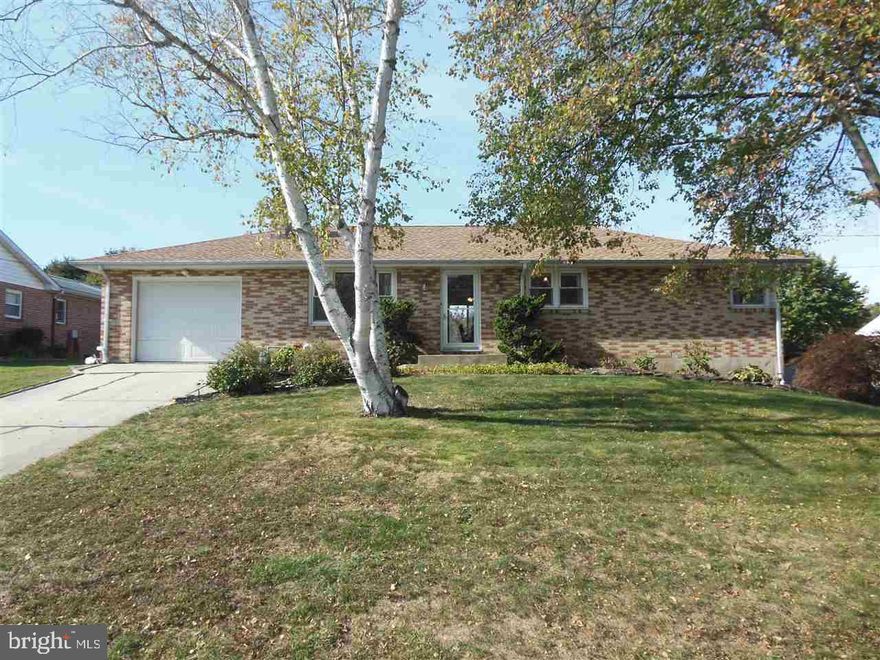 Move right into this well maintained 3 bedroom 2 1/2 bath brick ranch. Beautiful hardwood floors, wood burning fireplace in the living room, updated kitchen w/ ceramic tile flooring, dining room w/ sliders to the back deck. Master bath w/ Jacuzzi tub, finished lower level w/ a built-in wet bar plus a separate laundry room. Potential for an additional full bath in the basement-pre-plumbed for a shower. Replacement windows. Large fenced back yard!