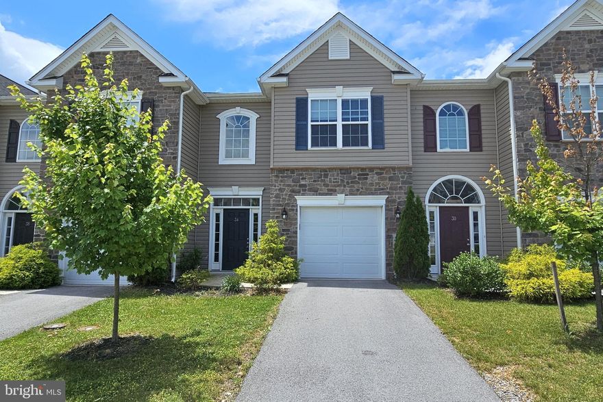 Great location, three bedroom, townhouse with garage in the amenity-rich Spring Mills subdivision. The home offers a beautiful open floor plan with upgraded kitchen featuring maple cabinets and granite counter top with low maintenance LVP stretching throughout the first floor.  The modern kitchen design features stainless steel appliances, a counter-height bar, and a large pantry.  The adjoining space includes an open area for dining that overlooks the family room and gathering space with a large window and glass doorway to the enclosed back yard, creating a nice and bright entertaining area.  The two-story foyer leads to a lofted hallway that provides access to the large primary bedroom with en suite bathroom, two guest bedrooms and a guest bathroom, plus included laundry on the upper level.  Throughout the community, enjoy the outdoor walking trails, picnic area with gazebo, and two tennis courts alongside a community swimming pool.  An overflow parking lot is included and only moments away from I-81 for commuting.