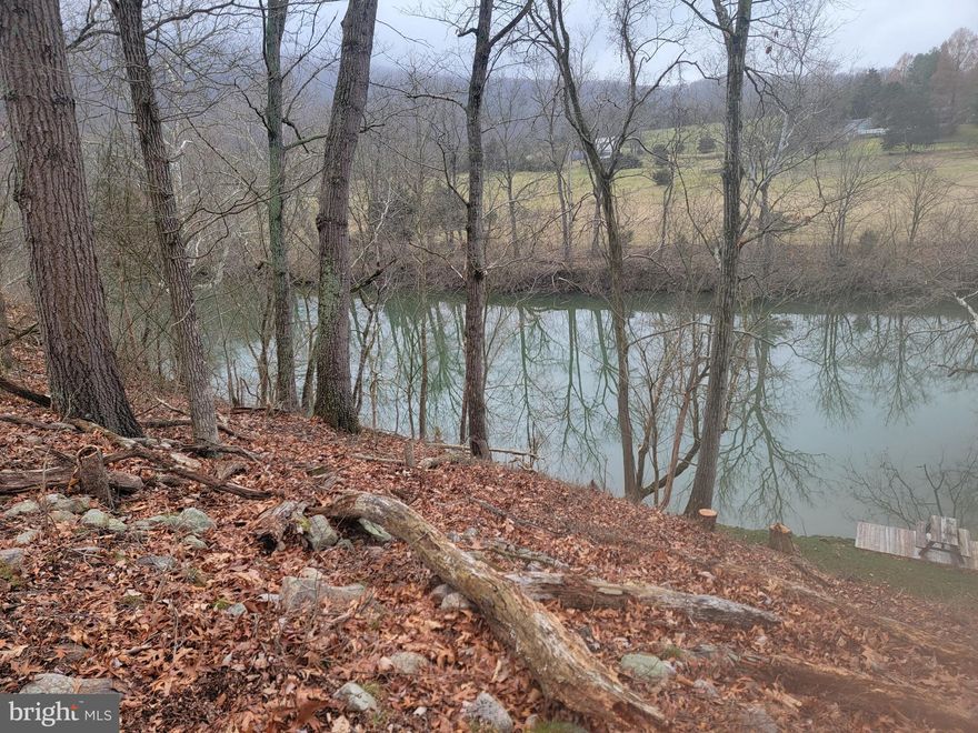 Riverfront lot in Leisure Point with well already installed, 3 bedroom drip system perc, and driveway installed.  The lot has been cleared for a house site.  Beautiful views.