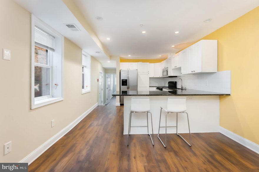 Exceptional Fresh and totally renovated apartment with in unit full size washer and dryer!!!  Steps from the University of Maryland Medical Campus, Camden Yards, M & T Stadium,  Downtown, I-95 on historic and serene “not  through” Hollins St.!  Urban  living at its  best!  This lovely has two bedroom en-suites a fabulous gourmet kitchen with granite counters and peninsula, a spacious living room with charming original mantle a combination of restored hardwoods and luxury vinyl flooring throughout, guest powder room and a paved side patio completes the picture!  Perfect for shared  living!