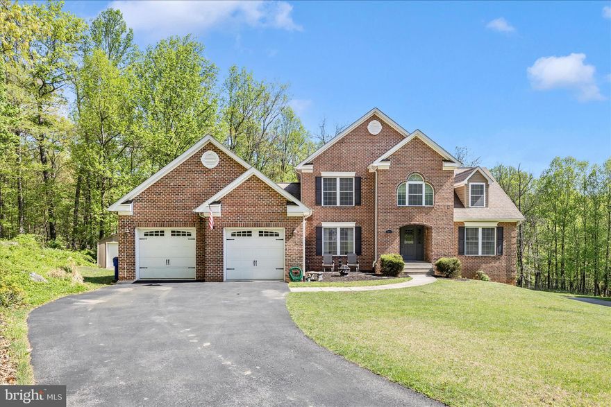 Refined Living on 1.63 Acres — Moments from Downtown Frederick
Situated on 1.63 acres, this exceptional one‑owner home masterfully blends timeless elegance, thoughtful design, and a highly sought‑after location just minutes from downtown Frederick—without city taxes. Offering five bedrooms, three full baths, and two half baths, the residence delivers refined living at its very best.
Designed for both elegant entertaining and comfortable everyday living, the home features a maintenance‑free deck overlooking serene wooded views and abundant wildlife, creating a peaceful backdrop for gatherings of any size.
The main level welcomes you with a formal foyer highlighted by a grand, wide oak staircase. A formal dining room adorned with a tray ceiling and architectural columns provides an elegant setting for memorable meals. The expansive family room showcases a soaring two‑story ceiling, a dramatic wall of windows that fills the space with natural light, and a gas fireplace—perfect for cozy winter evenings. This impressive space flows seamlessly into the spacious gourmet kitchen, thoughtfully appointed to host unforgettable dinner parties.
Two primary bedrooms with ensuite baths are conveniently located on the main level, offering exceptional flexibility and comfort for owners or guests. Also on this level are a well‑appointed laundry room with built‑in cabinetry and a conveniently located guest powder room.
The upper level offers three generously sized bedrooms, a full bath, and an open balcony‑style hallway overlooking the family room below, enhancing the home’s bright, open, and architecturally connected living experience.
The expansive lower level extends the home’s living space with high ceilings, abundant natural light, and year‑round comfort, as it is fully heated and cooled. A finished half bath and an existing rough‑in for an additional full bath provide outstanding flexibility, offering endless potential for a recreation area, home theater, fitness studio, or private retreat tailored to your lifestyle.
Completing the property is an oversized two‑car garage that easily accommodates two vehicles while providing generous storage both within and above. For added functionality, a large rear‑yard shed with an overhead door offers ideal space for lawn and garden equipment. A snowblower is included, enhancing both convenience and value.
This remarkable residence offers privacy, space, and sophistication—an extraordinary opportunity to enjoy elegant living in a tranquil setting just moments from the charm of downtown Frederick and close to all major commuter routes.