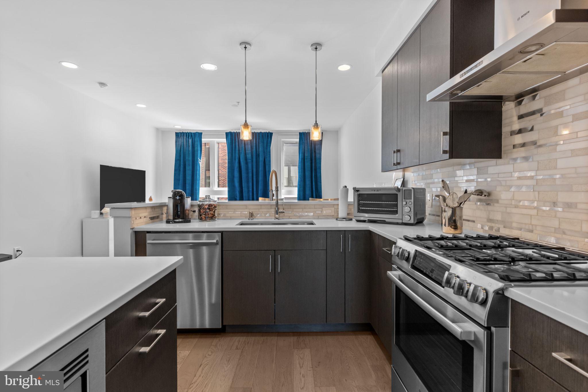 Picture yourself in this stunning 4-story townhouse offering sophisticated city living with premium finishes and thoughtful design throughout. This meticulously maintained 3-bedroom, 3.5-bath home features an attached garage, two private balconies, and a spacious rooftop deck with sweeping city views. Inside, you'll find high-end details at every turn, from the sleek open-concept kitchen to the spa-inspired bathrooms. With multiple outdoor spaces and a prime location in Northern Liberties, one of Philadelphia’s most vibrant neighborhoods, this home blends style, comfort, and convenience seamlessly.
As you enter the front door you're greeted by a spacious foyer where you'll find a convenient half bathroom, laundry room, utilities, and access to the one-car garage that boasts impressive additional storage. As you follow the staircase to the 2nd floor you find yourself in the dining room area that abuts a large balcony, making hosting indoor/outdoor functions convenient. Moving onward you'll find a high-tech kitchen equipped with stainless steel appliances and luxury finishes. Last stop on the 2nd floor is the expansive living room with large Bay windows flooding the room with natural sunlight. Up the staircase to the 3rd floor you'll find two expansive bedrooms, one with a full ensuite bathroom, and another full bathroom in the hallway. Finally, on the 4th floor you retreat to your penthouse bedroom, equipped with a tremendous walk-in closet and a vast bathroom sanctuary loaded with luxury and comfort. Lastly, find peace in your personal rooftop oasis that boasts unrivaled views of the iconic Philadelphia skyline.
Reach out today for more information!