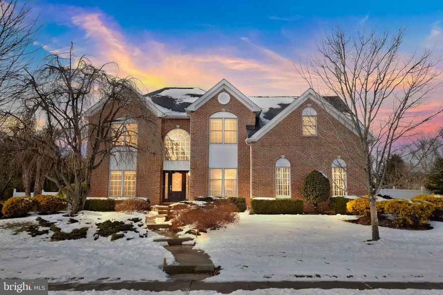 Bridle Estates stands as a highly sought-after premier neighborhood in Lower Makefield Township.  This exceptional single-family residence presents a brick front with professional landscaping, walkways, and automated outdoor lighting.  Upon crossing the threshold into a double height foyer with unique triple-turn staircase, one is greeted by the timeless allure of Brazilian walnut hardwood floors gracefully extending throughout the entire first floor.  A double door entrance leads to an office, that provides the perfect space for a private place to work or study.  Elegance defines the living room, adorned with wainscoting and crown molding, creating a sophisticated atmosphere for entertaining family and guests. The adjacent dining room is comfortably designed to seat large parties, boasting columns, wainscoting, crown molding, and a bay window that floods the space with natural light. Prepare to be impressed by the spacious eat-in kitchen that benefits from a culinary kitchen expansion and upgrades. Fully equipped with 42-inch custom cabinetry, granite countertops, a well-designed island with a gas cooktop, recessed lighting, a walk-in pantry, and stainless-steel appliances. As you step down into the grand family room with cathedral ceilings, you will find a striking stone front, wood burning fireplace, a large bay window with windowsill seating, as well as a convenient second rear staircase—a perfect spot to unwind with family and friends. Rounding out the main level is a half bath and a designated laundry / mudroom. Venture upstairs and through the double door entry of the luxurious primary bedroom complete with a tranquil sitting area, a dressing area with separate vanity, and a spacious walk-in closet. The en-suite bathroom provides a spa-like escape, creating a private oasis within your own home. Three generously sized additional bedrooms feature ample closet space and share a well-appointed hall bathroom and large hall linen closet.  The finished basement boasts your very own hockey rink, and an adjacent game room.  There is no shortage of additional storage closets and space.  Step outside through the sliding glass doors to discover an ultra-private rear yard oasis. This outdoor haven includes a sizable Brazilian Ipe hardwood deck that overlooks a peaceful backyard retreat boasting a beautifully curated land/tree scape creating a resort like atmosphere. Enjoy the inground gunite pool that has been updated with a cutting edge “hotspot energy” heat exchanger that allows for the pool to be heated with “free” heat, which maintains water temperatures into the 90-degree range if desired - the ultimate “green” luxury. A natural gas pool heater is also included to extend the season. Experience the pool's nighttime allure with its light wheel. Enjoy 2 distinct patio areas offering year-round maintenance free living.  A PVC privacy fence completes the backyard. The owners meticulously maintained and upgraded the house over the years – new HVAC 2022, newer roof, completely renovated chimney.  Additional amenities include a sprinkler system in front and back lawns, robotic auto mower yielding freshly cut grass daily and a fig tree that harvest figs each summer. The home is not located in a flood zone. Conveniently located near major commuting arteries, this residence ensures an easy commute. Shopping, restaurants, and medical offices are just minutes away, making this location ideal. All of this is part of the renowned Pennsbury School District, known for having the best prom in America. Don't miss out on the opportunity to own this stunning and well-maintained home.