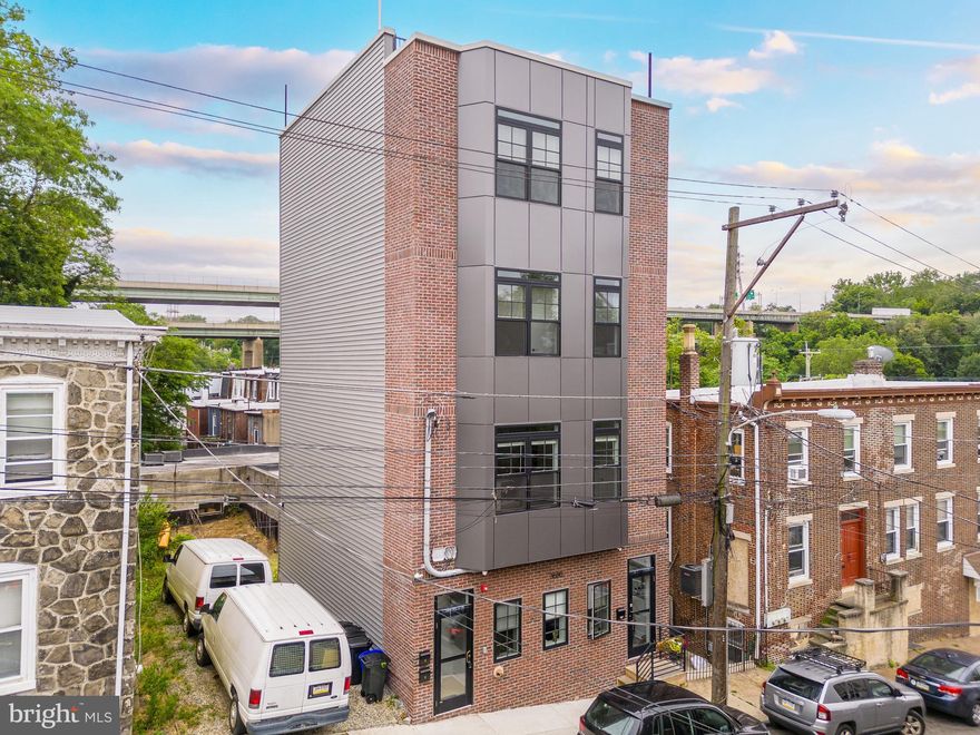 Welcome to Indian Queen Lane, a stately new construction triplex in East Falls (Philadelphia, Pennsylvania)—located just steps from the bustling Ridge Avenue commercial corridor, Kelly Drive, Schuylkill River Trail, Septa train station, Free Library, cafes, restaurants, pubs, breweries and bars. Residents of the building enjoy incredible access to Fairmount Park and Wissahickon Park systems, plus the waterfront. Easy access into Center City, University City, Bala Cynwyd, The Main Line and Philly's western suburbs.  This is a blue-chip 6%+ cap multifamily investment. Each unit is a 2bd x 2ba apartment (unit 2 has a powder room as well) with spacious living quarters and private outdoor space, including a panoramic rooftop with skyline and river views. 10 year tax abatement. Enquire within for financials on this spectacular boutique apartment building.