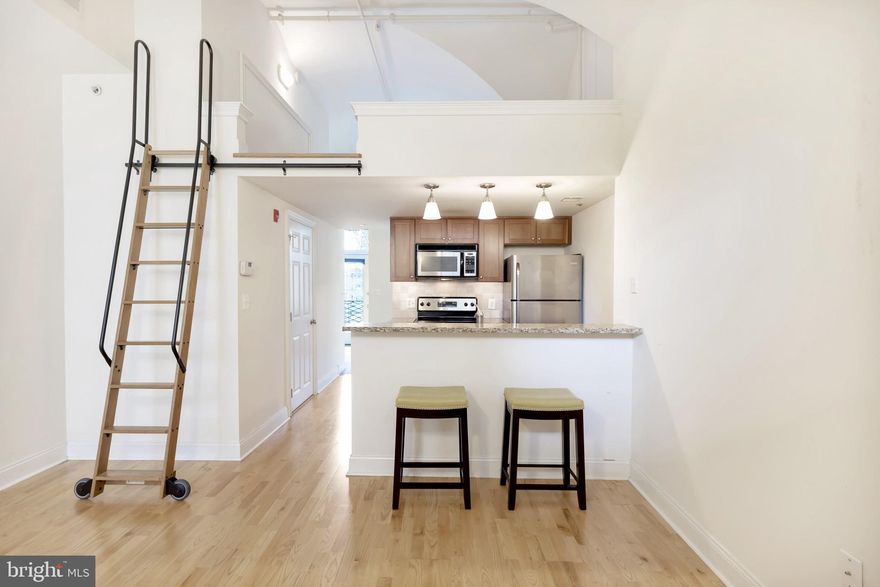 Attention Investors! Home is currently rented for $2,200 per month until April 30, 2027. Beautiful Naval Square Condo plus Loft with deeded parking space included, located at historic Biddle Hall. Rarely available 1 Bedroom 1 Bathroom + Loft. Loft can be used as a guest sleeping area, study, or whatever you prefer! This home with views overlooking the Naval Square parade grounds features an open concept with in home washer/dryer, and full bathroom. The Chef's kitchen has stainless appliances, large granite island and plenty of cabinet space, all overlooking the great room area. Down the hall is a full bath with ceramic tile, extra wide vanity with sink and a shower & toilet area. The bedroom features access to the large deck. The spacious deck measures approximately 9 feet by 17 feet and has plenty of room for both dining and lounging. Separate storage locker also included with home. Naval Square is a beautiful 20-acre guard, gated community conveniently located in Graduate Hospital. A quick walk to Rittenhouse and Fitler Square, HUP, CHOP and UPenn. This 24 hour guarded gated community offers lush spaces, tons of guest parking, a huge community pool, a fully equipped gym and public rooms. Please note, pictures are from between tenants.