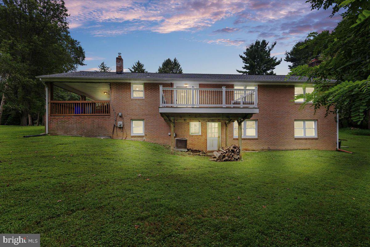 Beautiful brick rancher situated on nearly an acre in the sought after Mount Hebron area, surrounded by picturesque countryside. This charming home offers 3 bedrooms and 2.5 baths, with gleaming hardwood floors throughout and an attached carport. The kitchen/dining room combo features sliders to a spacious rear deck, perfect for entertaining or enjoying the serene views. The primary suite includes an updated private bath with dual vanities and a separate tub and shower. The lower level boasts a bright and expansive family room with full-size windows, a half bath, ample storage, and a walkout to the yard. Roof replaced in recent years for added peace of mind.