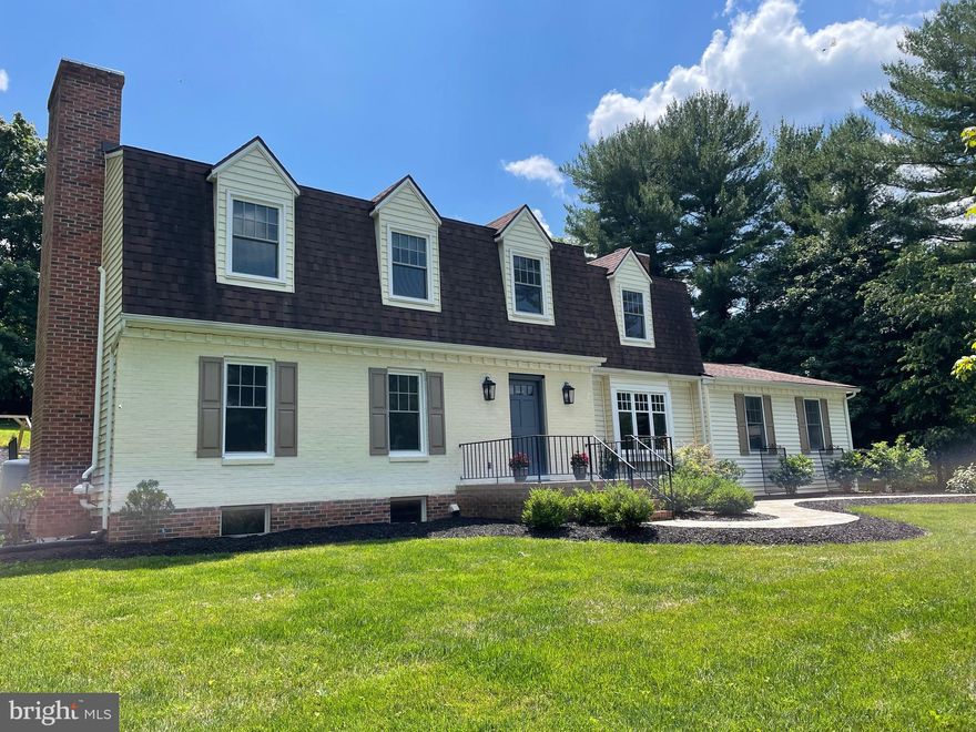 Tucked off the road is this wonderful Dutch Colonial offering a traditional floor plan.   First floor includes
a large  living rm , dining room,  updated kitchen with island, breakfast bar and quartz counter tops, breakfast room with built-in banquette,  family room and powder room.  Second floor has 5 bedrooms, 2 ensuite baths and one hall bath.  Additional features include new hardwood floors throughout, french doors, central air, 2 wood burning fireplaces and attached 2 car garage.  Lower level laundry with folding table, storage and plenty of room to design your own space.  Conveniently located within the Ruxton/Riderwood school district!