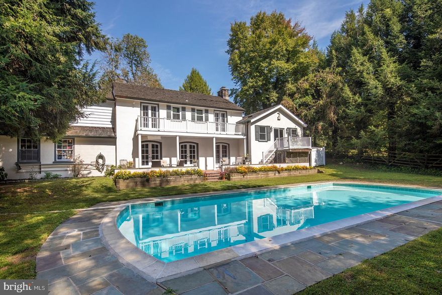 This charming history-rich home, once a barn as part of the Biddle estate, was originally on the site of a working apple farm, built in the late 1800's. The family s children, converted the barn into a unique summer retreat, creating additions * making updates in the late 60's/early 70's. Along the long private drive remain some of the original apple trees. The large estate sits on Duncan Lane.  The current property has an entrance marked by 2 stone pillars and the original wrought iron gates.  The private drive winds through the groundskeeper's cottage + the original Mill house, just below 200 Highland s property. Mature trees grace the grounds everywhere, with Ash, Holly & Japanese Snowbell among them. The land backs to Appletree Farm Land Trust, affording incredible beauty & lasting privacy. Appreciating the stunning natural setting is blissful, especially from wonderful outdoor patios & decks that provide a private retreat for relaxing & entertaining. A large in-ground pool completes the tranquil back yard and is designed to bring hours of enjoyment, whether for swimming laps, hosting pool parties, or cooling off on hot summer days. While offering an incomparable country setting, this special residence sits in a prime location convenient to all amenities, including shopping in Bryn Mawr, Haverford & Ardmore, public & private schools, and train transportation. Also within walking distance, blue-ribbon award winning Coopertown Elementary School and a public park complete with tennis courts. In addition to the gorgeous grounds, a stucco exterior with cedar roof & decorative shutters catches the eye. Inside a gracious hardwood foyer with staircase introduces elegance & leads to 2 bedroom suites each complete with full bath and showers and featuring balconies overlooking the private yard & pool. At right, a hall with closets proceeds to the light-bathed great room with windows on 3 exposures, built-ins & picturesque views all around. A half-level down is the bright, spacious master bedroom with sliding doors to a tranquil private deck & stairs to the lower patio. Pocket doors present a sky-lit master bath with a double sink & oversized shower for unwinding. Continue down another half level to the expansive living/dining room & kitchen/breakfast area (with an outside entrance) for seamless entertaining. The generous living/dining room boasts a wood-burning fireplace & 3 arched sets of French doors extending to the patio oasis. Off the dining room is a galley kitchen with granite countertops, farmhouse sink w/disposal, 6-burner range, built-in refrigerator & dishwasher, wine fridge, workstation + pass-through w/hanging bar for extra seating. From the kitchen, you also have entry to a powder room & attached 2-car garage. Excellent storage + a partial basement w/laundry complete this finely done, storied home!