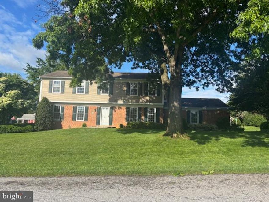 As you arrive at 1 Enck Drive, you're greeted by a beautifully landscaped yard with mature trees, shrubs, and vibrant flower gardens. A brand-new stone paver walkway and stoop lead you to the inviting front entrance of this classic two-story home. Step inside to find a spacious layout featuring a formal living room and dining room, perfect for entertaining. The large kitchen boasts Corian countertops, a seamless sink, and plenty of cabinet space, flowing effortlessly into the cozy family room with a fireplace—ideal for relaxing evenings. Just off the family room, a screened-in porch invites you to enjoy the outdoors in comfort. Upstairs, you’ll find four well-sized bedrooms, including a primary suite, along with a recently updated hall bathroom. Throughout the home, thoughtful updates include new flooring in the kitchen, hallways, family room, and upstairs bath. The home also features a full unfinished basement with a French drain and two sump pumps, offering endless possibilities for storage or future living space. A two-car attached garage provides additional convenience. Practical updates ensure peace of mind, including central A/C and a whole-house humidifier (2010), a heat pump/water heater (2013), an architectural shingle roof (2012), a radon removal system (2014), and Leaf Filter gutters with underground extensions. The home also includes a propane gas stove with an underground propane tank for added efficiency. Tucked away in a peaceful neighborhood yet close to everything, this home is ready to welcome its next owners!