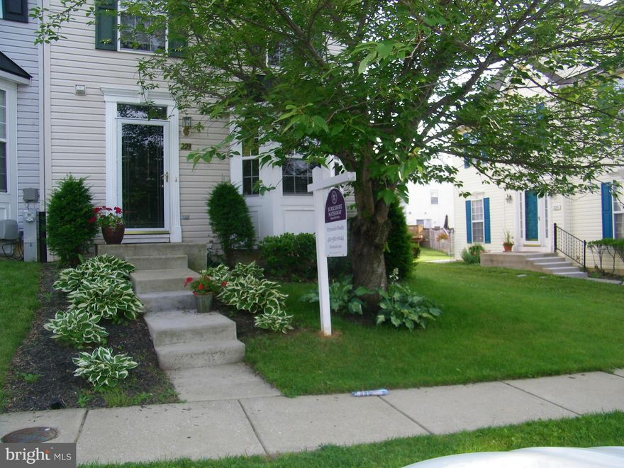 LARGE END UNIT TOWN HOME IN REISTERSTOWN VILLAGE* SPACIOUS KITCHEN ADJOINS BUMP OUT FAMILY ROOM* WOOD FLOORS* FIREPLACE IN NICELY FINISHED LOWER LEVEL*DECK WITH BACK AND SIDE YARD* CONVENIENT LOCATION* SUBJECT TO THIRD PARTY APPROVAL*SHORT SALE IN  PROGRESS WITH ONE LENDER* SOLD AS IS