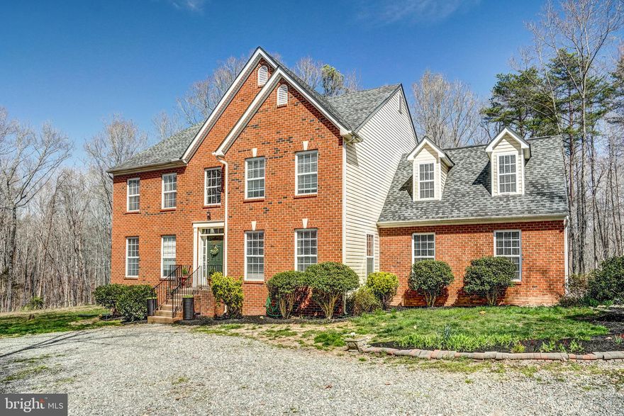 Must see this classic 2-story brick home with rear and accent siding and attached 3 car garage on 5 acres! Convenient location close to I-64, perfect for your commute to Zions Xroads, Richmond, and Charlottesville. This expanded traditional floorplan w/3500+ sq ft offers 4 bedrooms, 3 baths, formal dining room, large family room w/propane fireplace, formal sitting room or office, an open loft room/3rd living space upstairs and separate laundry room off the garage. Many upgrades have been made including new hardwood and LVP flooring throughout, direct backyard access to the rear deck, new glass panes in the french doors of the illuminating sunroom, new interior light fixtures in multiple rooms, entryway, and exterior of the home and fresh interior paint in almost every room! Other renovations also include the kitchen cabinets, backsplash, fixtures, window, and updates made in the primary and secondary bathrooms. The shared private country road leads you to your secluded homestead with charming curb appeal and picturesque circle shaped driveway. FIREFLY fiber high-speed internet available here! Less than a 5 minute drive to Southern Revere Cellars Brewery. They play live music, are kid friendly, host trivia nights, farmers markets, food trucks and more.