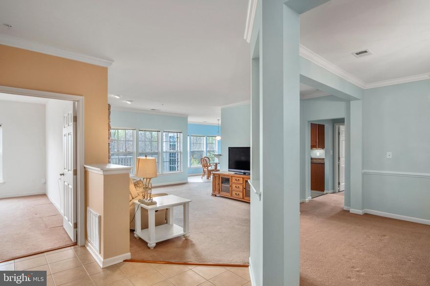 Stunning 55+ Condo in Eden Brook! Check out the AMAZING views!! Located on the 3rd level. Elevator & Secured building. 2 Large Bedrooms and 2 Bathrooms. Cozy Stone Fireplace in the family room. Kitchen w/Granite counters, dining/breakfast/sunroom area, 42" Cab's and SS appliances. Lots of upgrades and details throughout including chair railing, crown molding, Lrge garden tub in 2nd bathroom & extra shelving, Separate formal dining room. Master suite with sitting room, private bath & huge walk-in closet. Master bathroom with dual sinks and walk-in shower. Plenty of storage. Exterior Balcony with the best views in the Subdivision! This condo is a 10! Mint condition! Close to all major traffic routes, DC/Baltimore/Annapolis, Ft Meade, NSA, MARC train station, restaurants and local shopping centers! Community clubhouse