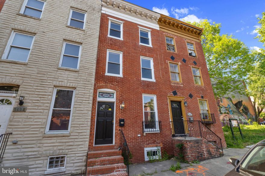 Welcome to the heart of historic Hollins Market—where classic Baltimore charm meets modern living. This beautifully renovated three-story townhouse offers the perfect blend of style, space, and functionality.

Step inside to discover a thoughtfully updated interior featuring an open and inviting layout, ideal for both everyday living and entertaining. The home is filled with natural light throughout, enhancing the warm finishes and contemporary touches.

Upstairs, the expansive top-level primary suite is a true retreat—bright, airy, and generously sized, offering the perfect space to unwind. Each level provides comfortable living with well-appointed bedrooms and updated baths.

Out back, you’ll find a rare, oversized fenced yard—an entertainer’s dream. Whether hosting gatherings, enjoying outdoor dining, or creating your own private oasis, this space offers endless possibilities.

Located in the vibrant Hollins Market neighborhood, just minutes from downtown, stadiums, and major commuter routes, this home delivers the best of city living with room to breathe.
