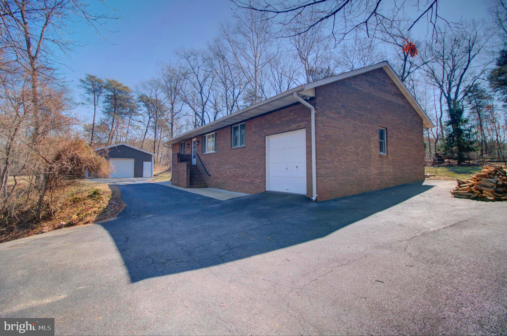 Tucked away in a serene, wooded enclave beside the State Park, this delightful 3-bedroom, 1-bathroom raised brick rancher offers a rare combination of privacy, practicality, and charm. Inside, you'll find a warm and inviting layout with generous space for everyday living and relaxation.
The attached oversized garage delivers convenience and versatility, while the massive 24' x 44' detached garage—complete with running water and a full bathroom—opens the door for endless possibilities: workshop, creative studio, guest accommodations, or entertainment zone. Need more storage? A separate container is ready to house tools, equipment, or seasonal gear.
With 2 acres zoned W1 in Anne Arundel County, this property offers tremendous flexibility. Whether you're envisioning a homestead, a business-friendly setup, or a peaceful personal retreat, you'll find it here.
Recent updates like a new roof (2022) and a water heater (2019) add to the value, making this a turnkey opportunity surrounded by nature—with all the modern amenities within easy reach.