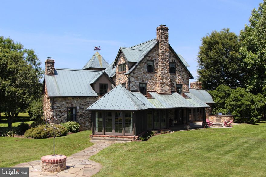 8 Stillmeadow Lane is situated atop one of Willistown Township's rolling open hillsides.  With vistas and protected view sheds, the property also sits on a private dead end lane.  This exceptional setting was inspirational in the selection of a most discerning team of architects, builders and landscape designers.  The current owner has enhanced the original vision by expanding the once small kitchen into a more modern, eat-in floor plan, using plenty of glass to bring the outdoors in.  The property was elected "Home of the Year" by Custom Home magazine when originally built in 1992. The use of copper roofing, stone exterior, flagstone and brick patios in multiple courtyards, and balconies at elevation, is a testament that this home was built to last in a timeless location.  Many interior features include reclaimed hardwood and a rustic but modern use of steel.  The most spectacular craftsmanship is used throughout, but perhaps it is most well demonstrated through the barrel-vaulted great room with a 15 foot ceiling, recreated barn ruins gable end with massive fireplace.  This room has French doors on the west and east which can create an open-air passage from the central flagstone courtyard to the more casual fire pit, grill area and back lawn.  It is also open to the dining area and kitchen with two islands.  Perfect for entertaining!Overall the property boasts 5 bedrooms, 4 full and 3 half baths over approximately 7,000 square feet*, and pool with equally spectacular pool house.  The bedroom configuration ensures privacy for family and guests with a first floor master suite, 2 mirror-image 2 story bedrooms each with sitting rooms, and a bedroom on the west end, en-suite with enchanting tower sitting room with views.  The 5th bedroom is part of a separate but attached section of the house including an in-law suite with magnificent views, 3 car garage and private yet expansive upstairs office.  The next owner will surely enjoy this amazing, unique and whimsical offering.The land consists of just over 10 acres in two connected but separate pieces, 5 acres +/- of which is vacant land under conservation easement, which allows for a future 4 stall barn to be built should an equestrian use be desired.  (please see conservation easement and township zoning for exact details, including but not limited to square footage limitations etc.)8 Stillmeadow Lane is convenient to Philadelphia, the Main Line, Septa R5 commuter and Amtrak regional trains, PHL and Brandywine airports, Wilmington, West Chester, first rate educational institutions and cultural activities, all within 10 to 45 minutes drives.*square footage is estimated from previous owner  and should be verified by buyer.