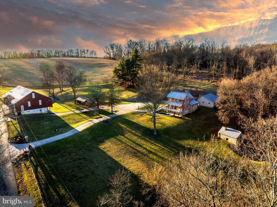 Live authentically. Oak Ridge Farm. Quintessential 1867 farmhouse set among a spectacular 76.46 acres of rolling countryside. A storybook setting steeped in Hereford Zone history. Lovingly redesigned between 2002 and 2007 with every detail meticulously considered.  Finishes complete with materials original to property. Carefully expanded to create desirable open kitchen with modern day amenities while  maintaining original character and charm. The springhouse and barn predate the home.  It is believed that the barn was constructed in 1865.  Renovation was completed in approximately 2006 by the Amish and is roughed in for potential future use as stable. Large detached garage with unfinished upper level space.  Ample space to hunt, hike and explore wooded area filled with mature oak, birch, locust and cherry trees. Direct access to the NCR Trail. Fields being farmed by local farmer.  Privacy, peace and tranquility.  A true lifestyle in northern Baltimore County. Cultivate your existence.  The art of uniting human and home.