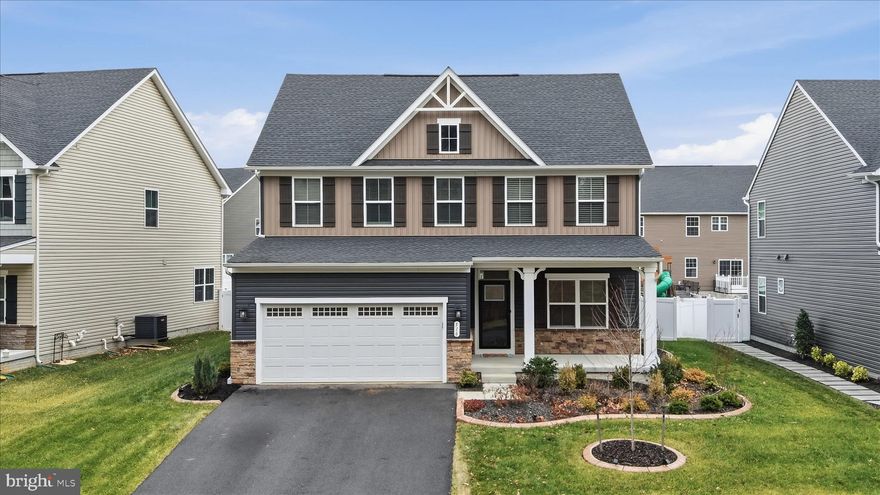 Don’t wait for new construction when this like-new home is ready for immediate occupancy! Located in the desirable Lakes at Martinsburg community, this beautifully maintained home offers three fully finished levels and an open floor plan ideal for today’s lifestyle. The gourmet kitchen boasts 2 ovens, built in microwave, tons of cabinet space, large island plus dining area. Family room open to kitchen and dining. Formal living room or could make an office at the entry. Enjoy a welcoming front porch overlooking peaceful woods, perfect for relaxing mornings or evenings. Main level have LVP floors. All bedrooms are generously sized, including a spacious primary suite with a walk-in closet and large private bath. Convenient upstairs laundry adds everyday ease. Enjoy the private fenced back yard from your maintenance free deck. HOUSE BONUSES: Tesla charger, Peloton Bike.
 The community features a lake, jogging and walking trails, dog park, and tot lot, offering something for everyone. Move-in ready and waiting for you to call it home!