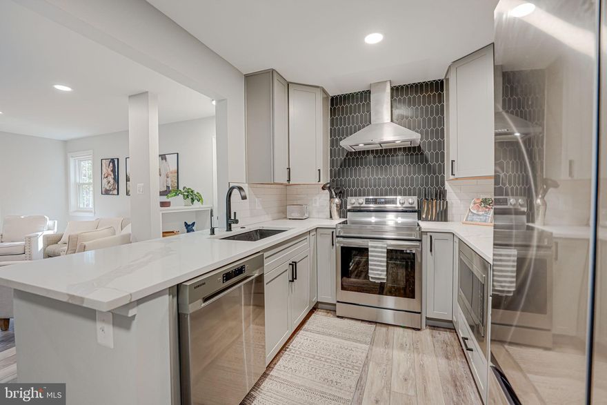 Welcome to Lovedale Lane —a beautifully renovated 2-bedroom, 1-bath condo offering modern comforts and a serene retreat feel in the heart of Reston. Perfectly located, surrounded by the amenities of Reston, this ground-floor unit is nestled among mature trees, creating a private, tucked-away feel with all the conveniences of Reston nearby.

Step inside to a fully transformed space, where tasteful upgrades have been completed within the last year. The remodeled kitchen features brand-new stainless steel appliances, custom cabinetry, expanded counter space, and a stylish backsplash, as well as a coffee and wine bar—perfect for both entertaining and relaxing.
New flooring throughout and a redesigned, modern  fireplace mantle give the home a cozy, updated feel. Both bedrooms open onto a large, mostly covered patio, complete with a ceiling fan, creating an ideal space to unwind outdoors in any season. The renovated bathroom is designed with attention to detail, offering a new vanity, mirror, tub, counters, and flooring. Additional upgrades include a new HVAC system and in-unit washer and dryer.

This pet-friendly condo provides a convenient lifestyle with a one reserved parking spot, ample guest parking, and a fabulous location. Residents have access to tennis courts right next door, as well as Reston Association’s trails, pools, and recreational facilities. Just minutes away, Reston Town Center offers shopping, dining, entertainment, and vibrant community events throughout the year.

With its blend of modern style and natural serenity, this condo is ready to welcome you home!