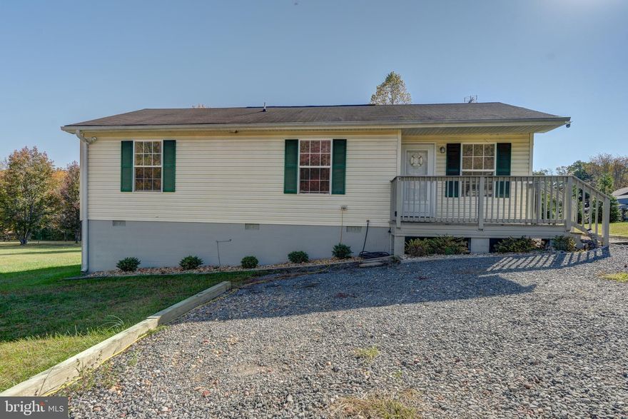 Charming Lake Anna water-access retreat located on the public side of the lake. Nestled in the desirable Anna Coves Subdivision, this fully furnished, turn-key rancher offers easy one-level living and endless lake enjoyment. Featuring 1,036 square feet of cozy comfort, this 3-bedroom, 2-bath home includes a detached garage with lean-to and an additional shed—currently set up as an unfinished tiny house ideal for storage, a studio, or a home office. The living room flows into the dining area and kitchen complete with granite countertops. The generator conveys and the John Deere lawn mower also conveys—making this home truly move-in ready.  Spend your fall evenings in your back yard by the fire pit and your summer days enjoying the neighborhood’s private waterfront amenities: a sandy beach, picnic pavilion, built-in grill, boat ramp, and boat slips available on a first come, first serve basis. Perfectly located on the public side of Lake Anna, just minutes to grocery shopping, local restaurants, golf, the Lake Anna Taphouse, and several local wineries and breweries. This retreat already has a proven rental history making it a great investment, perfect secondary retreat or a full time home. New heat pump in 2024. Come experience the best of lake life at Lake Anna at an affordable price!